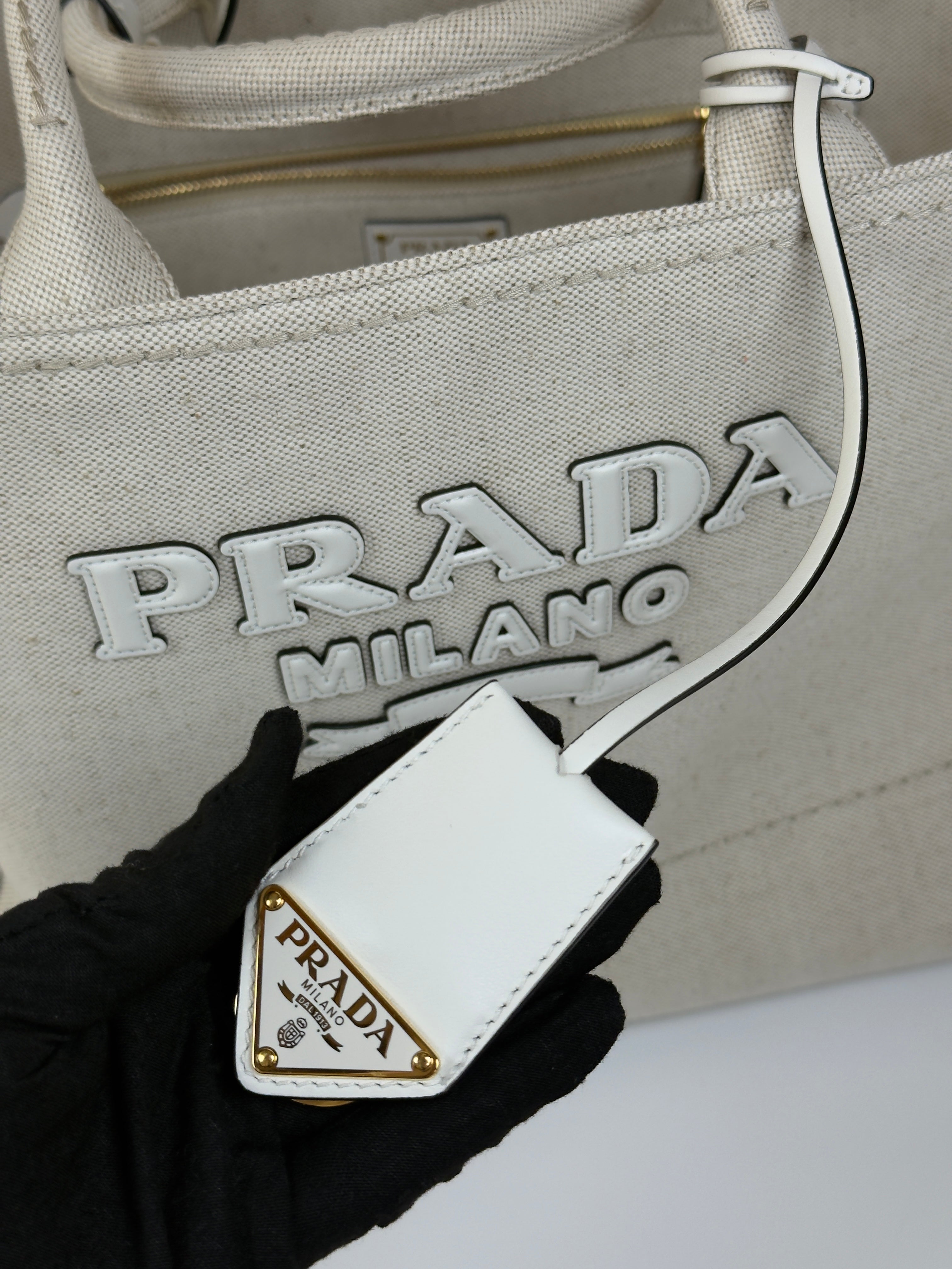 Authentic and preloved Prada Large Appliqué Cotton Tote In Sand Beige Canvas. Excellent Condition. 100% Authenticity guarantee.