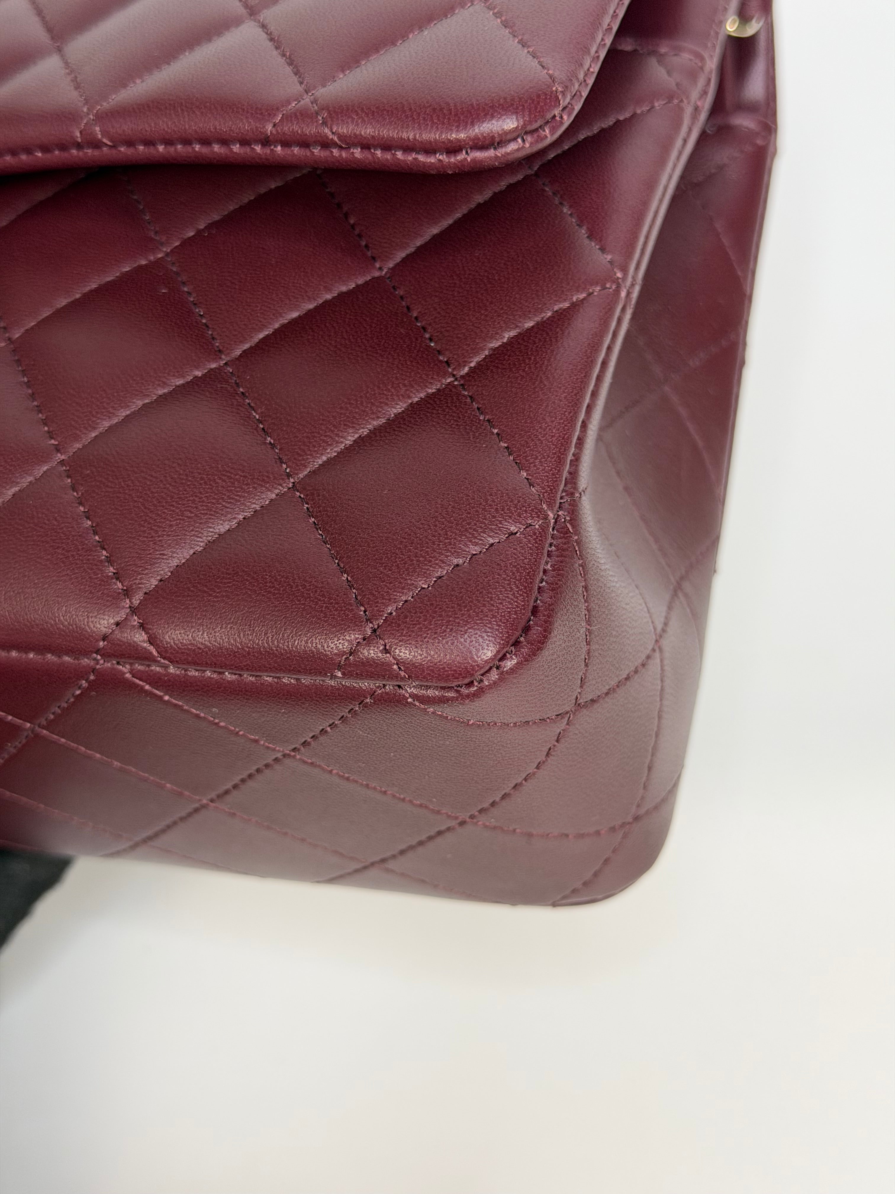 Chanel Medium Classic Double Flap Burgundy Lambskin Leather With Pale Gold Hardware. Authentic and preloved in excellent condition with 100% authenticity guarantee.