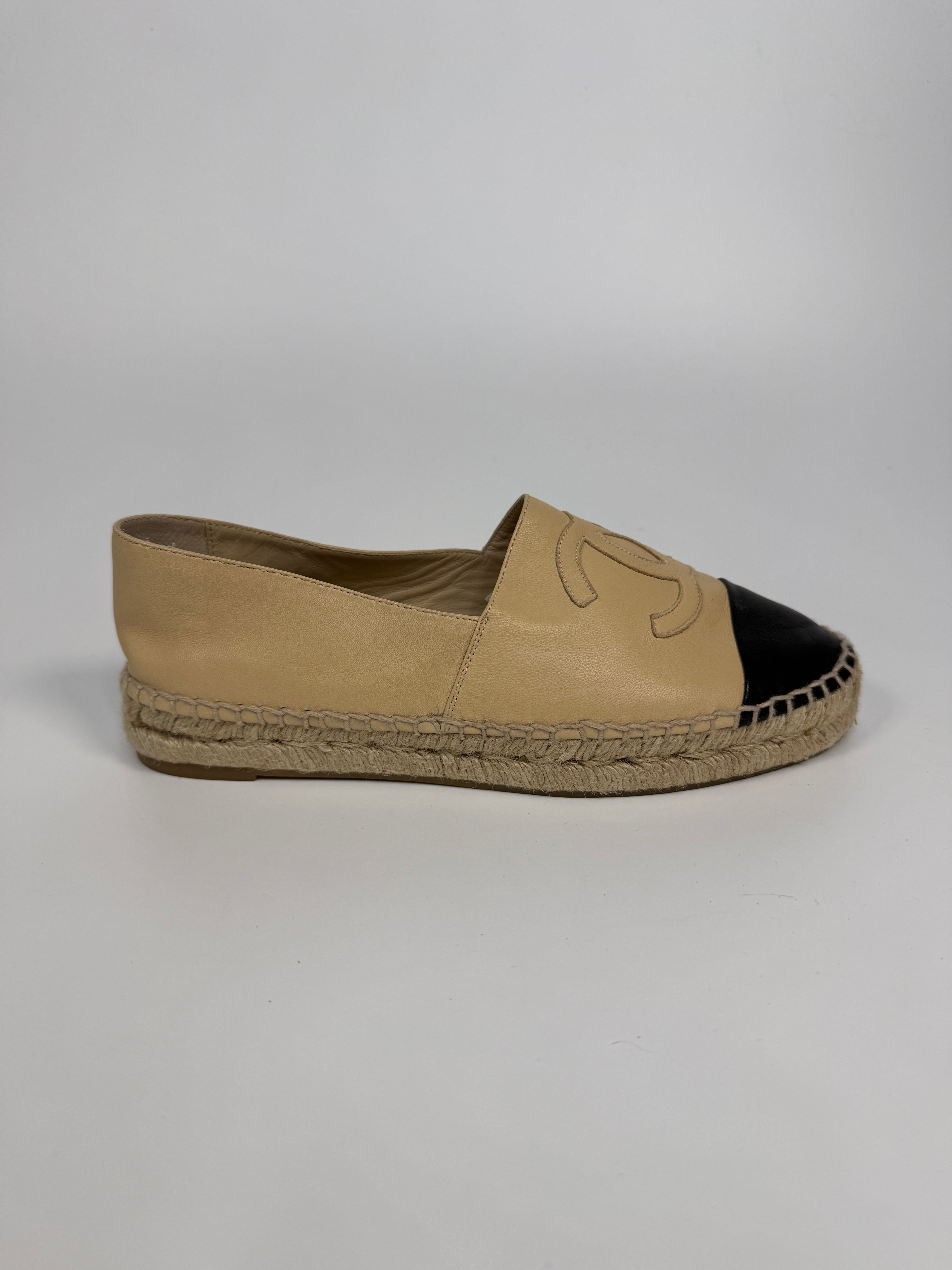 Authentic and preloved Chanel Espadrilles (Size 38/UK5) In Beige and Black Lambskin Leather. Excellent condition. 100% Authenticity guarantee