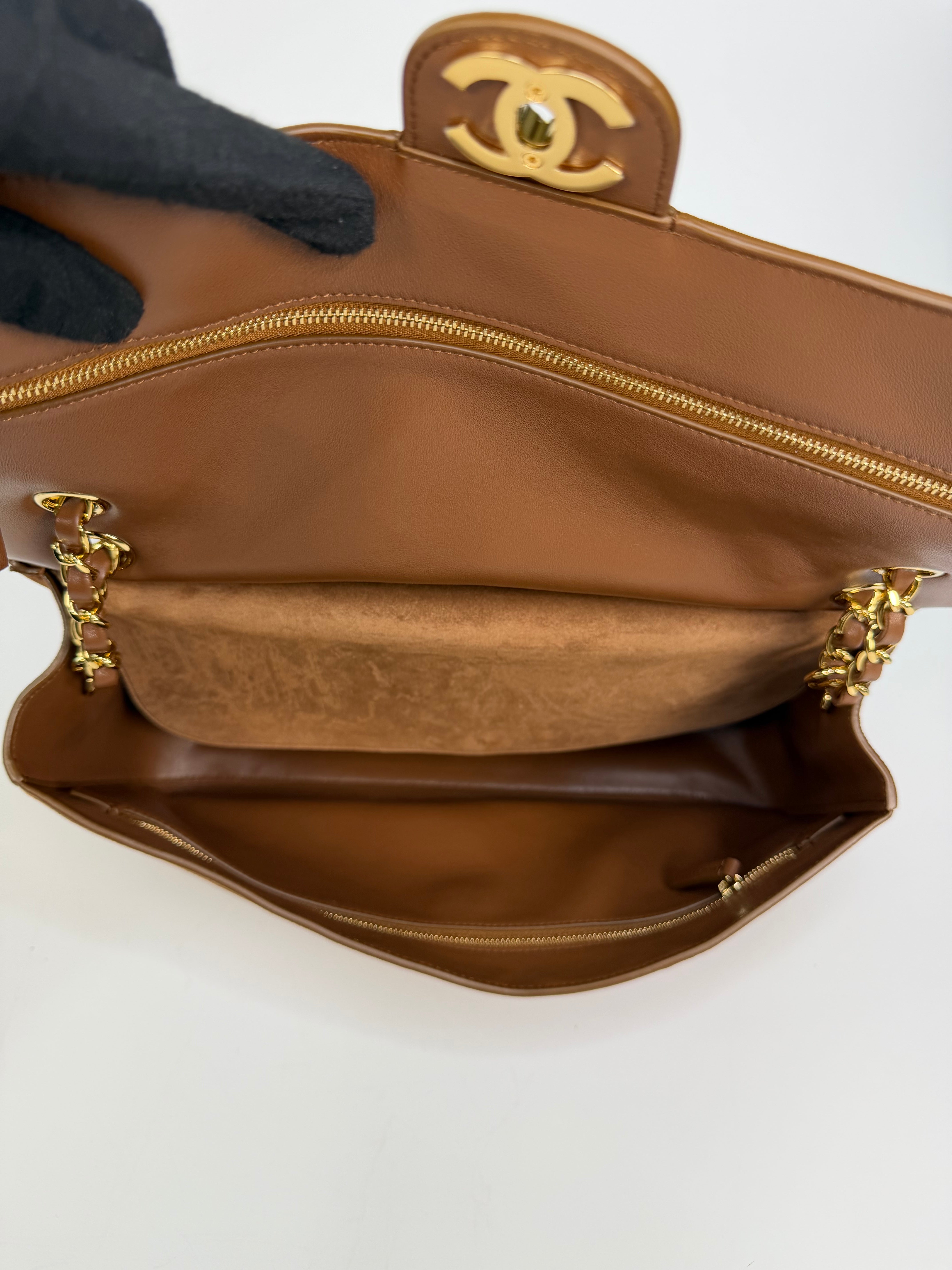 Chanel Maxi Flap In Tan Suede With Gold Hardware. Authentic and preloved in new and unused condition.