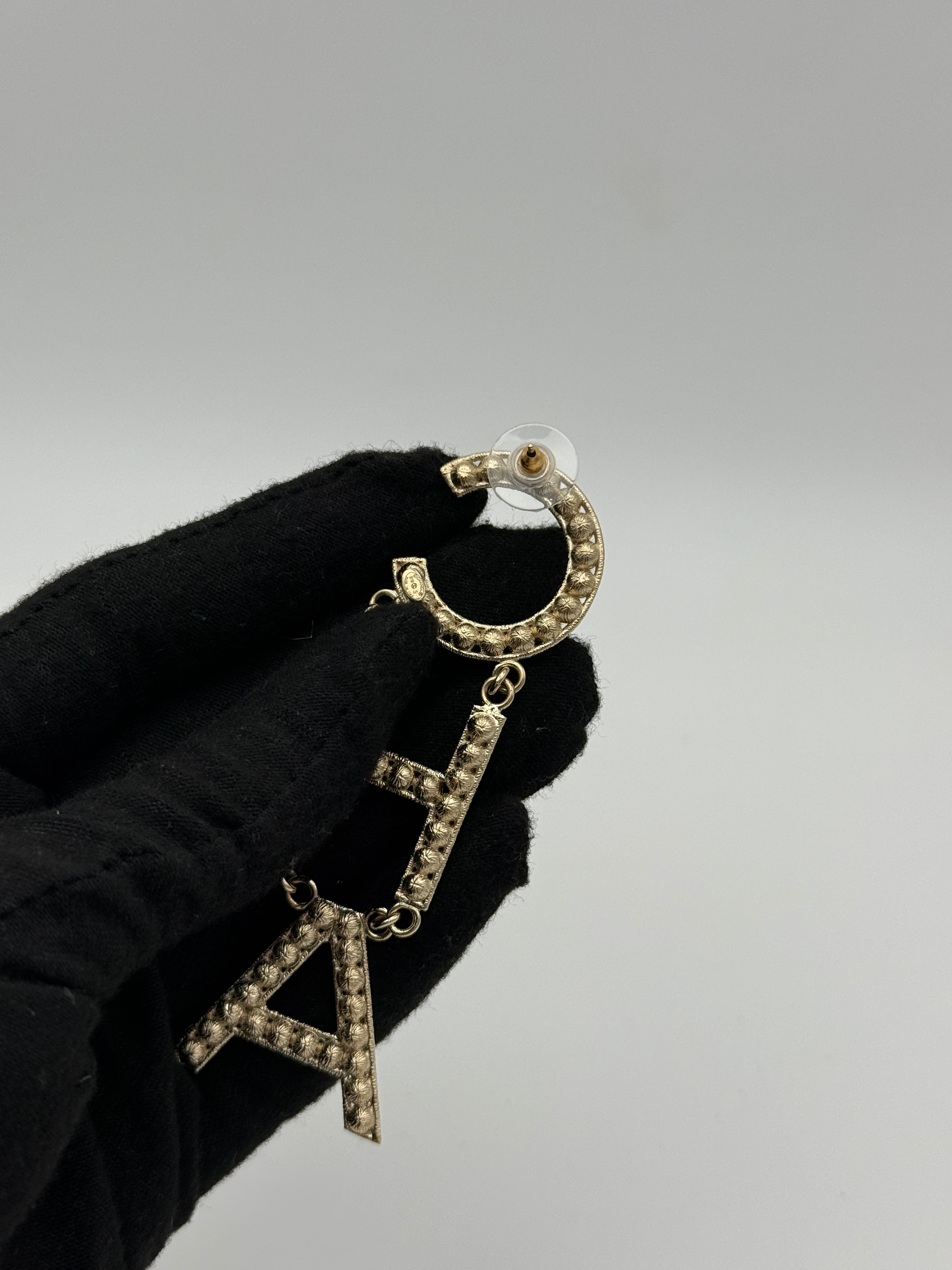 Authentic and preloved Chanel Crystal-Embellished Logo Earrings. 100% Authenticity Guarantee. Verified by Luxe Cheshire