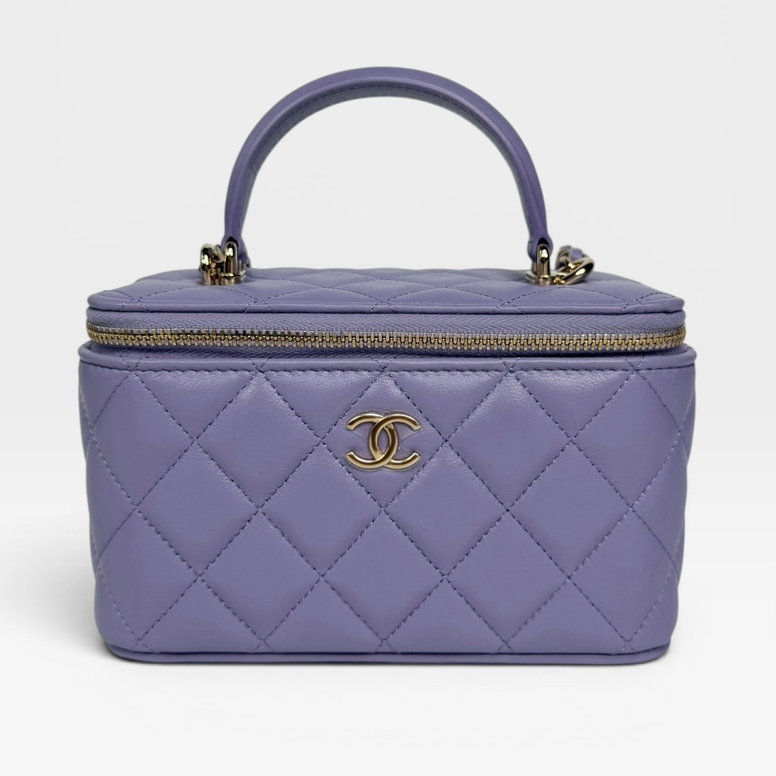 Chanel Mini Vanity Top Handle In Lilac Lambskin Leather With Gold Hardware. Authentic and preloved in excellent condition