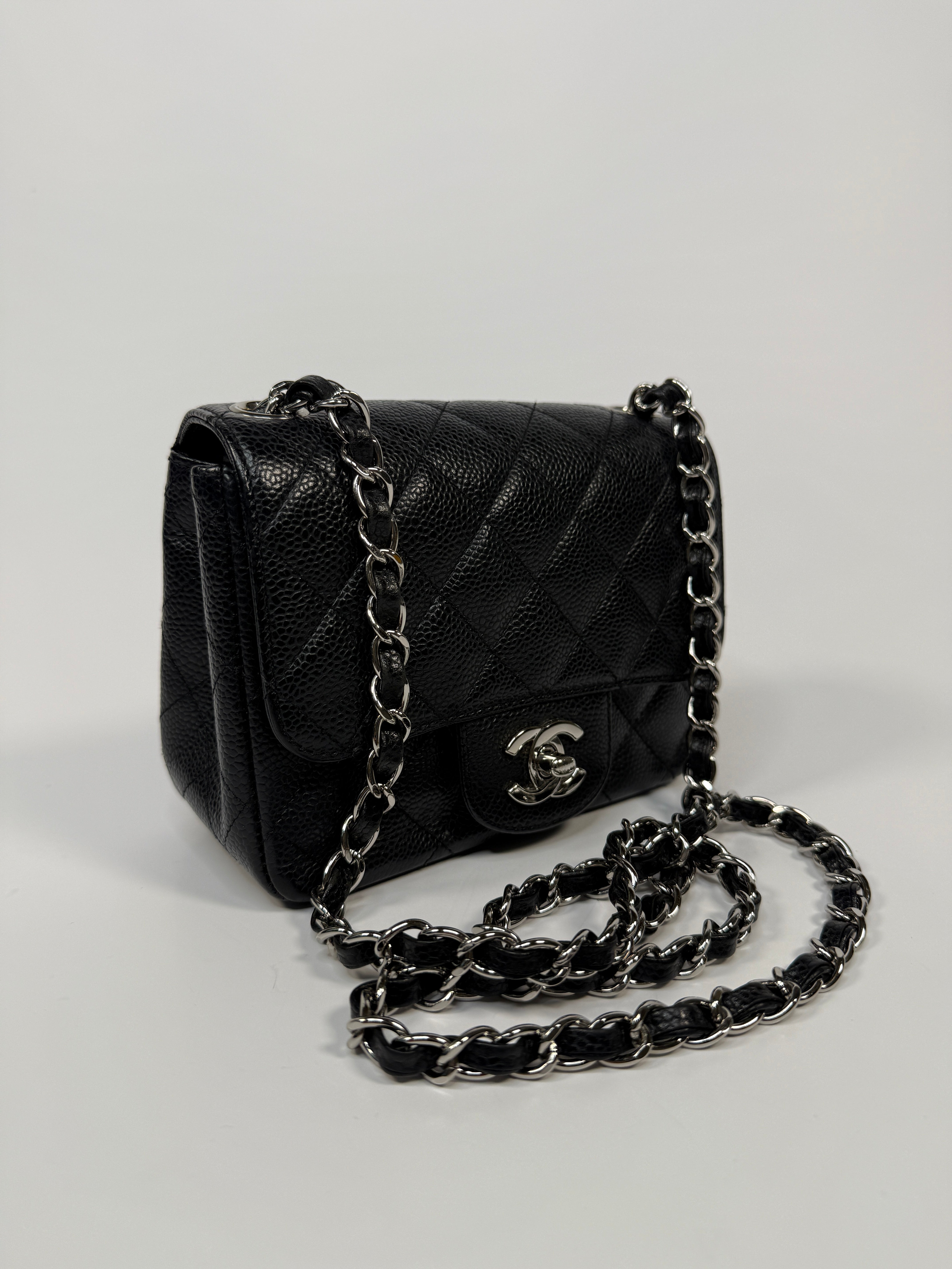 Chanel Black Square Flap Bag In Black Caviar Leather With Silver Hardware. Excellent condition. Authentic and preloved.