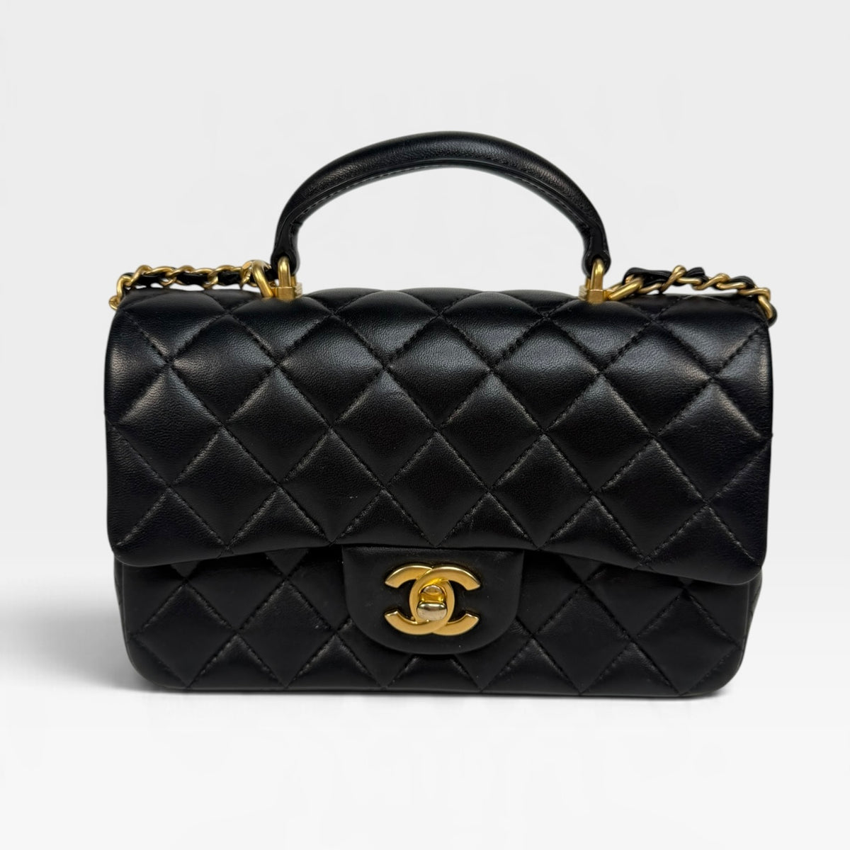 Chanel Mini Rectangle Top Handle In Black Lambskin With Gold Hardware. 100% authentic and pre loved in excellent condition.