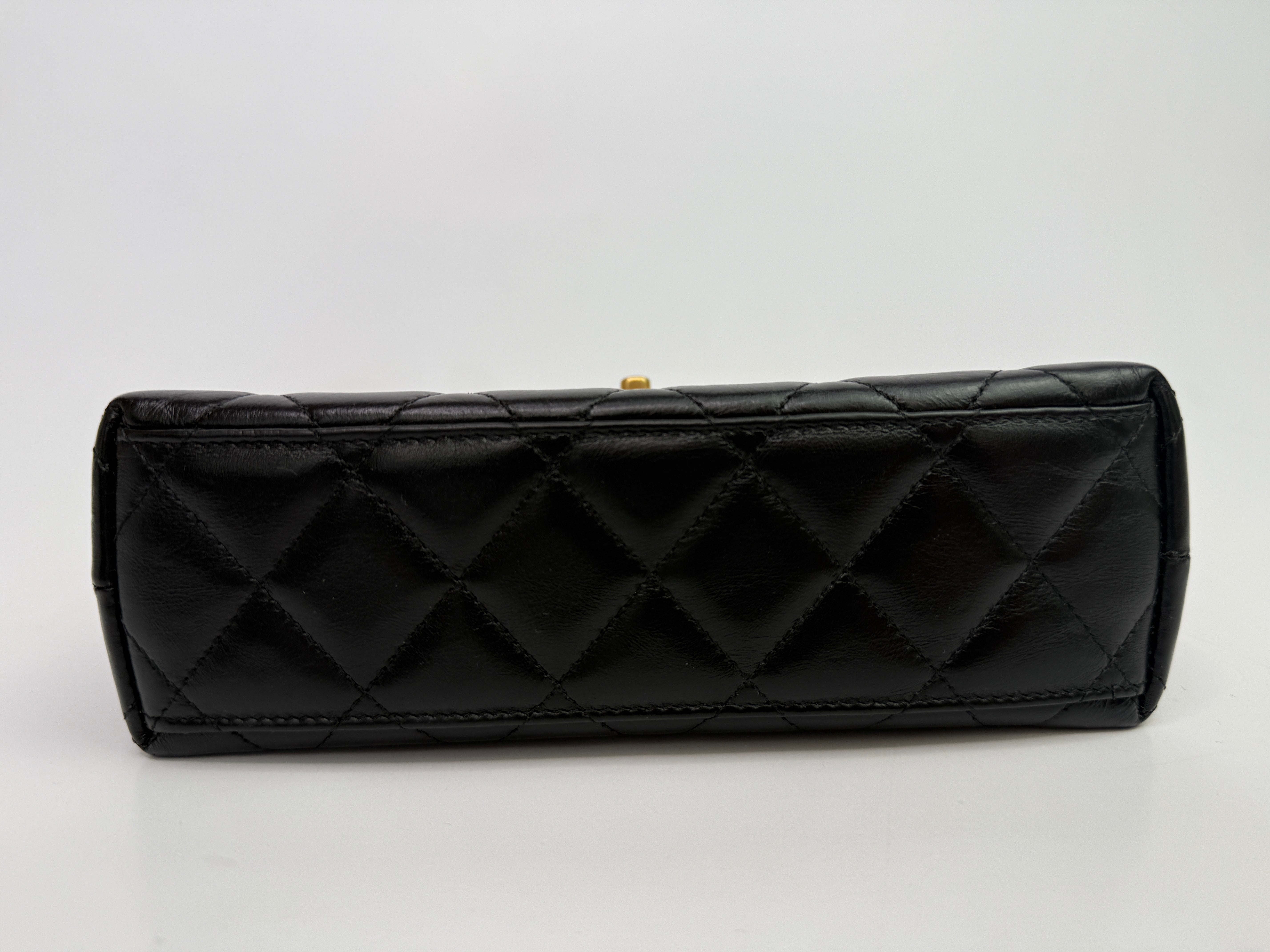 Chanel Mini Kelly Bag In Black Calfskin Leather with Gold Hardware
Pre Loved & Authentic
