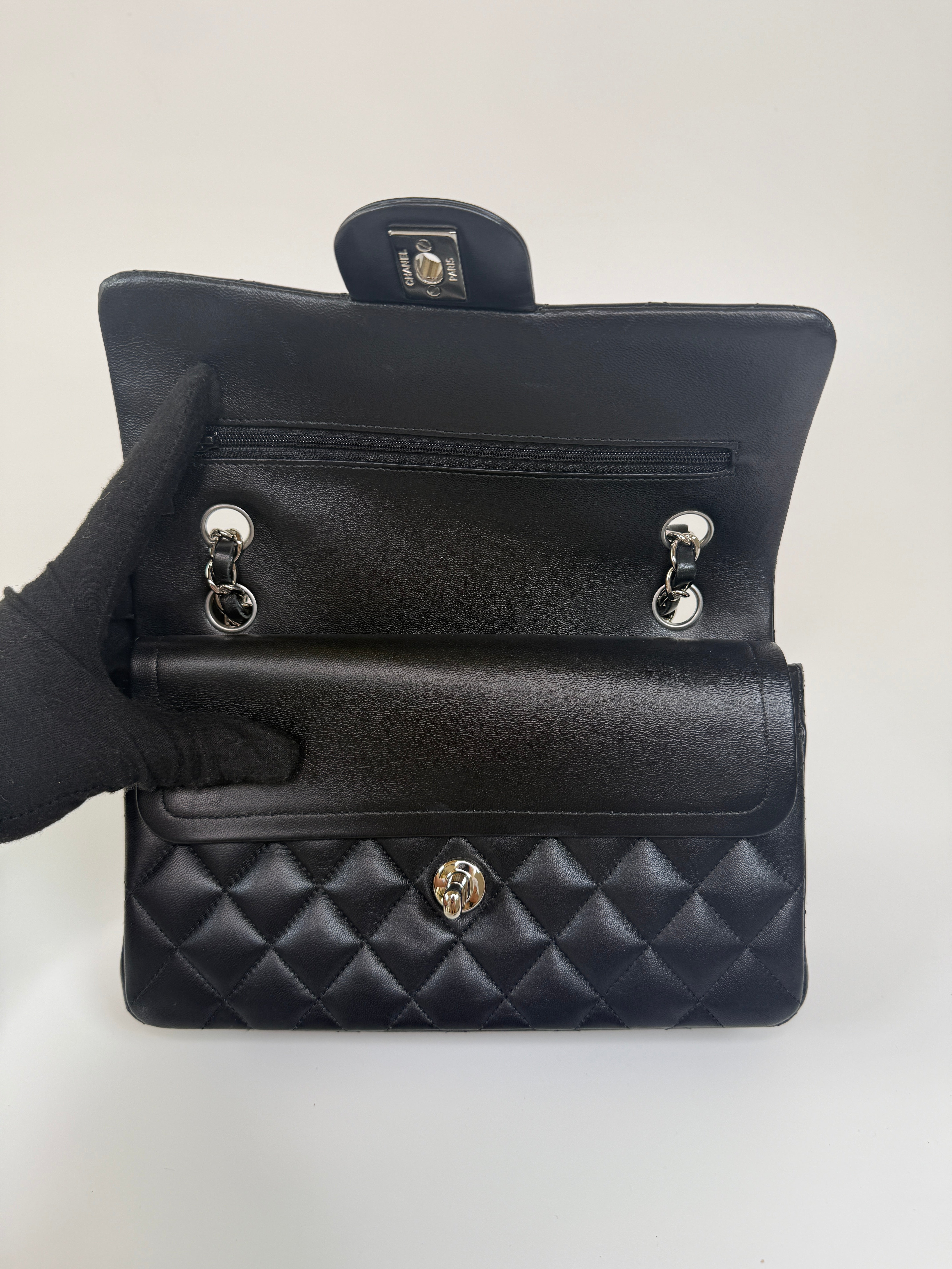 Chanel Small Classic Double Flap In Black Lambskin Leather With Silver Hardware Authentic and preloved in excellent condition. 100% Authenticity guarantee