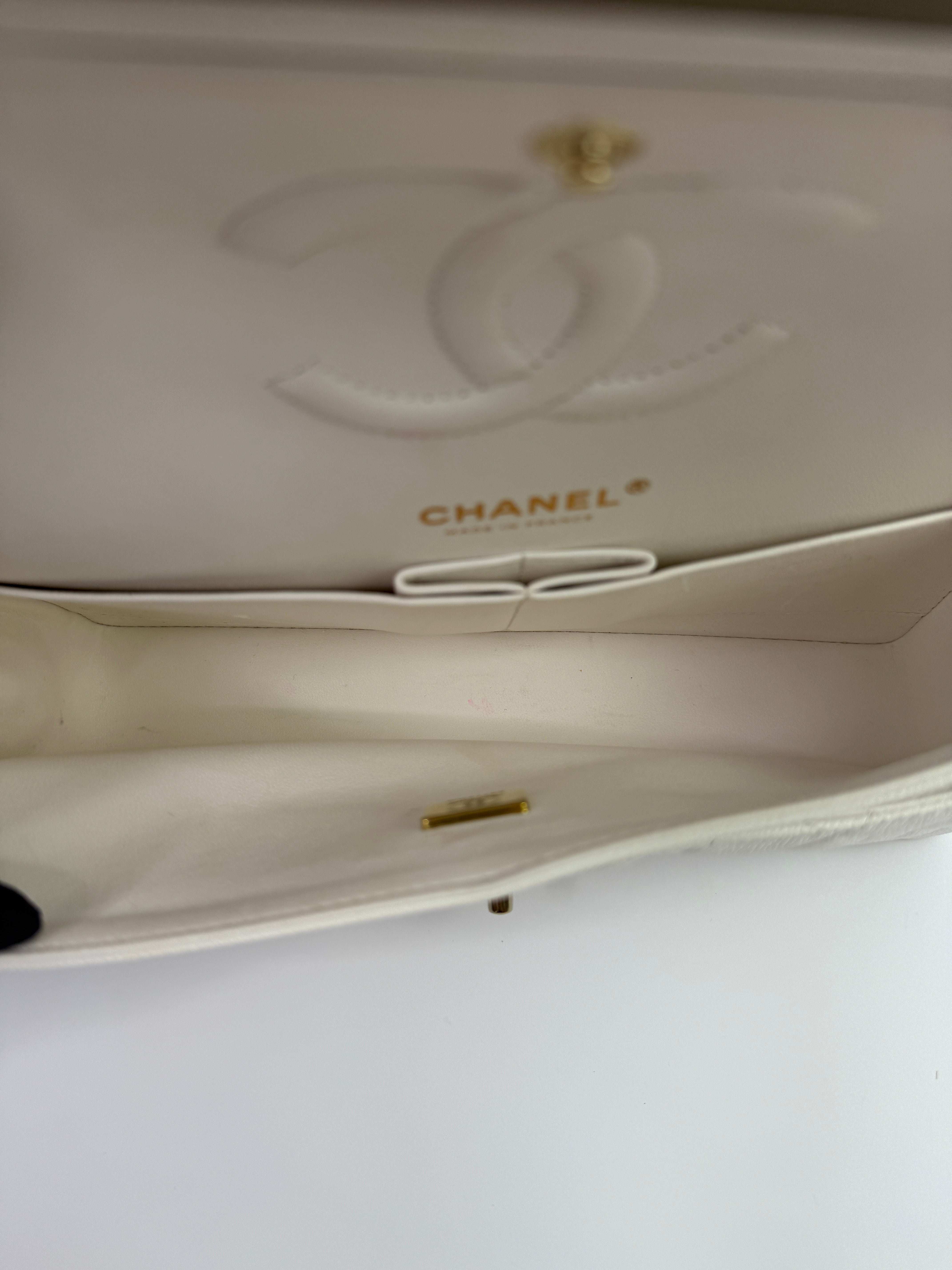 Authentic pre-loved Chanel Medium Classic Double Flap White Caviar Leather With Gold Hardware.