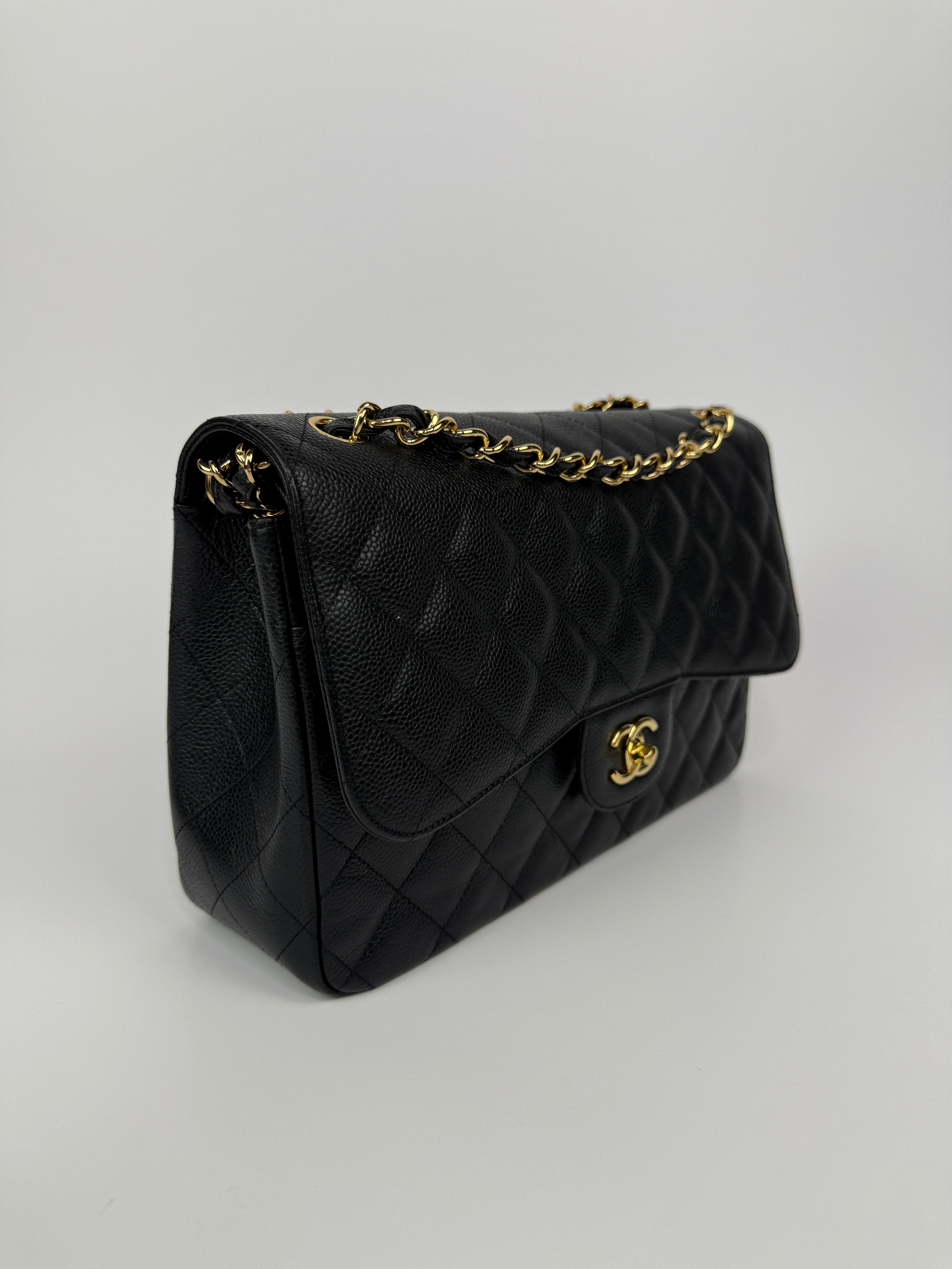 Chanel Jumbo Classic Double Flap In Black Caviar Gold Hardware
Pre Loved & Authentic