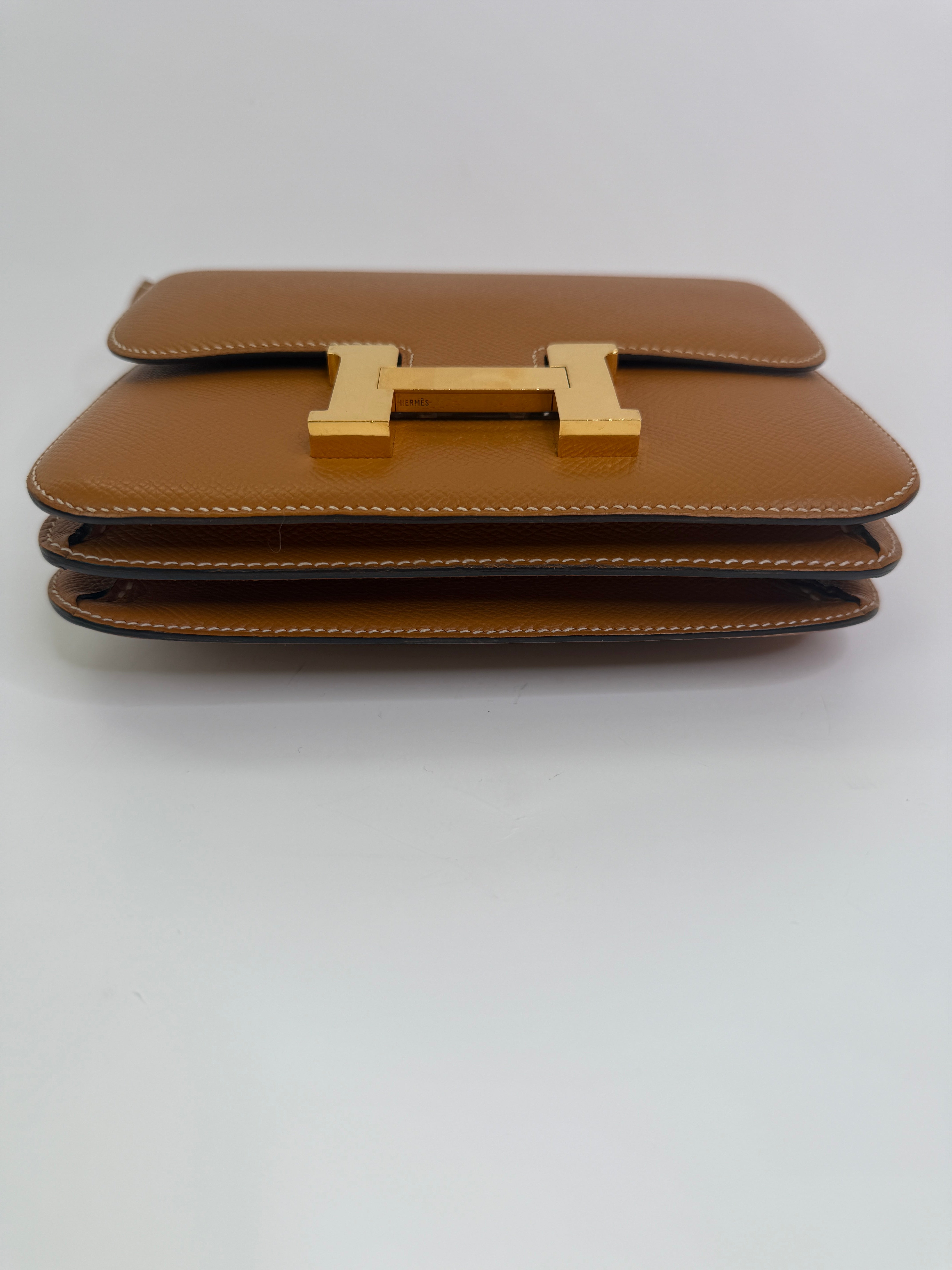 Authentic pre-lovedHermès Constance 18 In Toffee Epsom Leather With Gold Hardware.