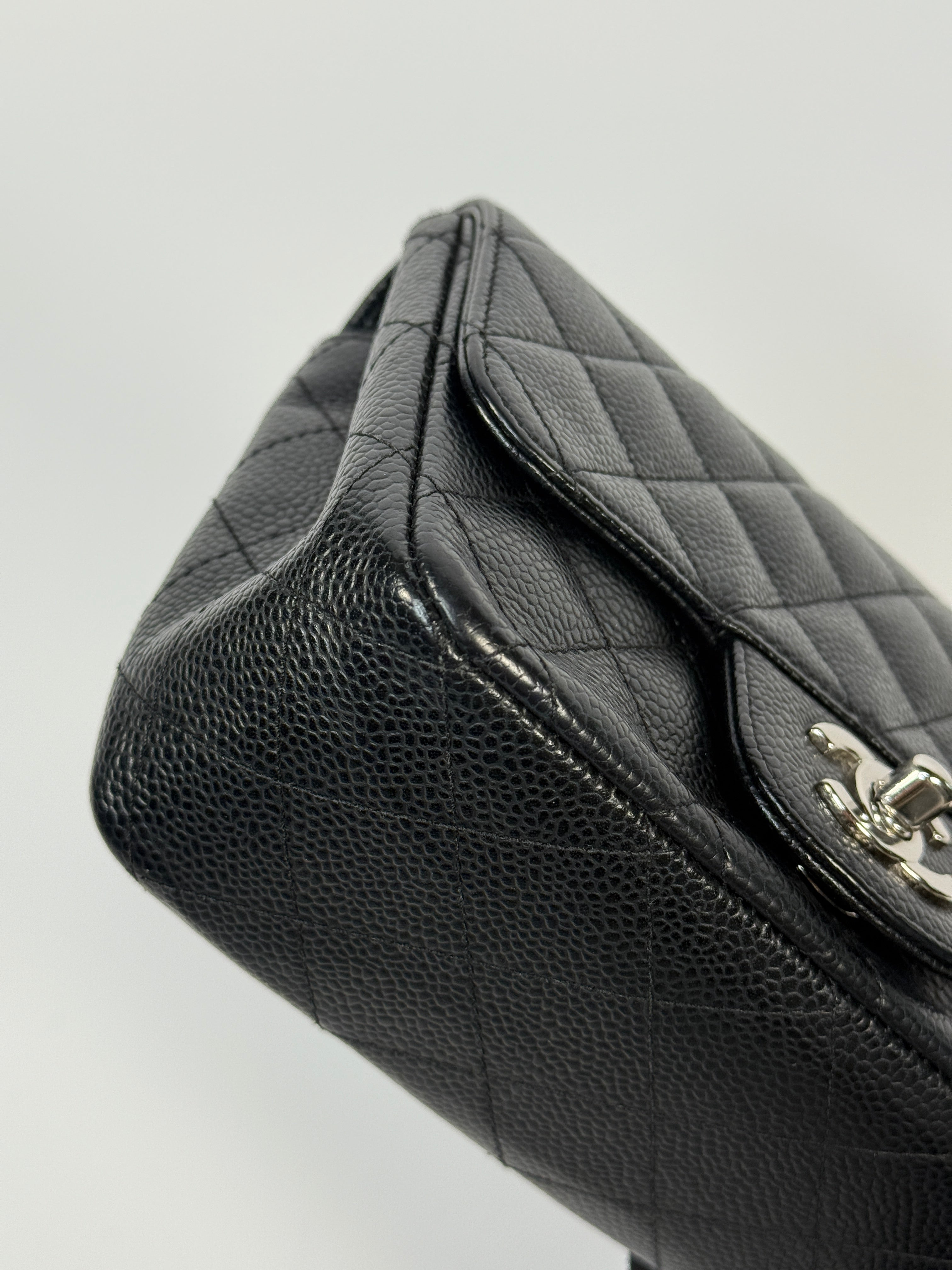 Chanel Black Square Flap Bag In Black Caviar Leather With Silver Hardware. Excellent condition. Authentic and preloved.