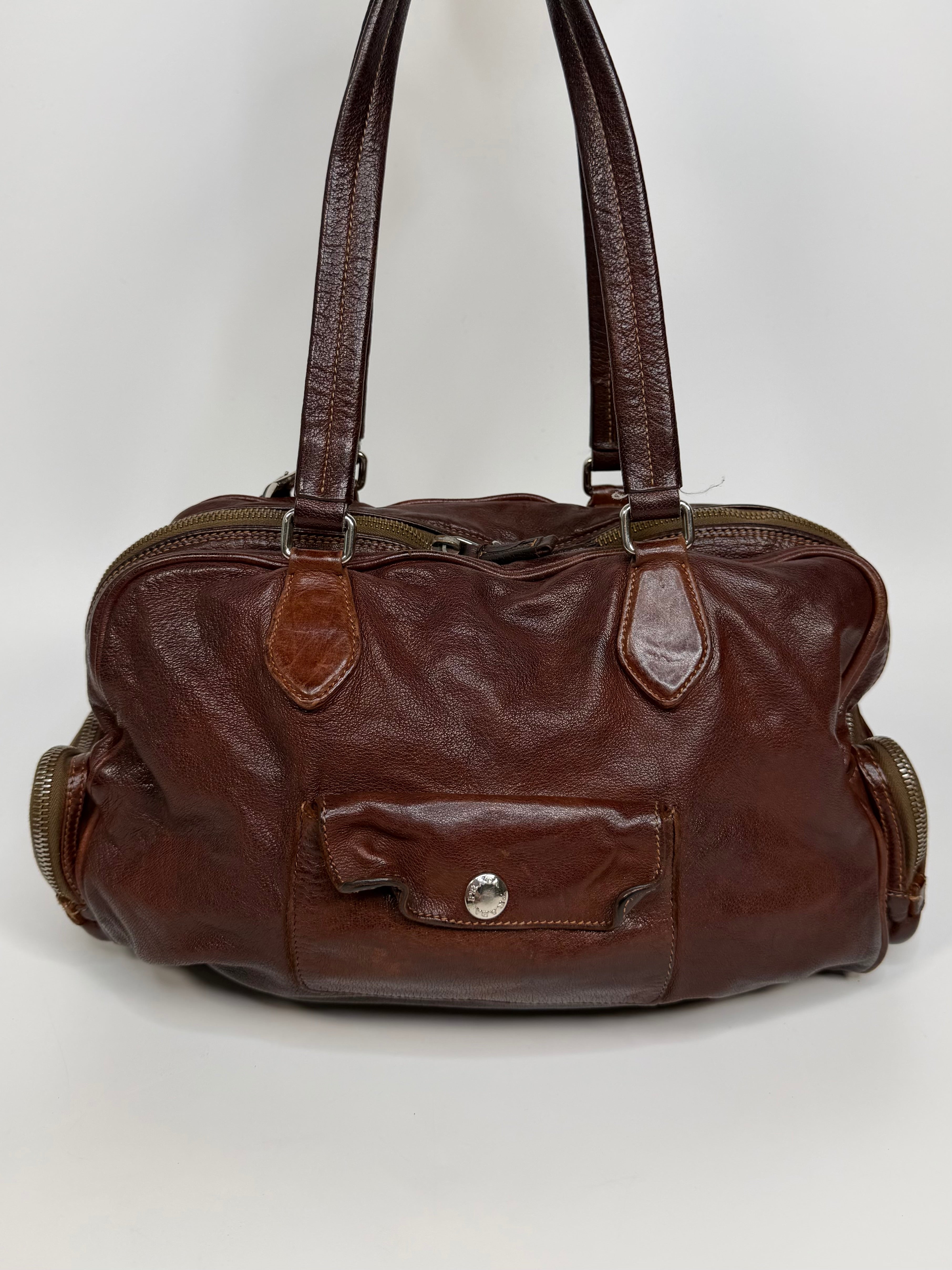 Prada Washed Bauletto Shoulder Bag In Brown Leather With Gold Hardware. Authentic and preloved in very good condition
