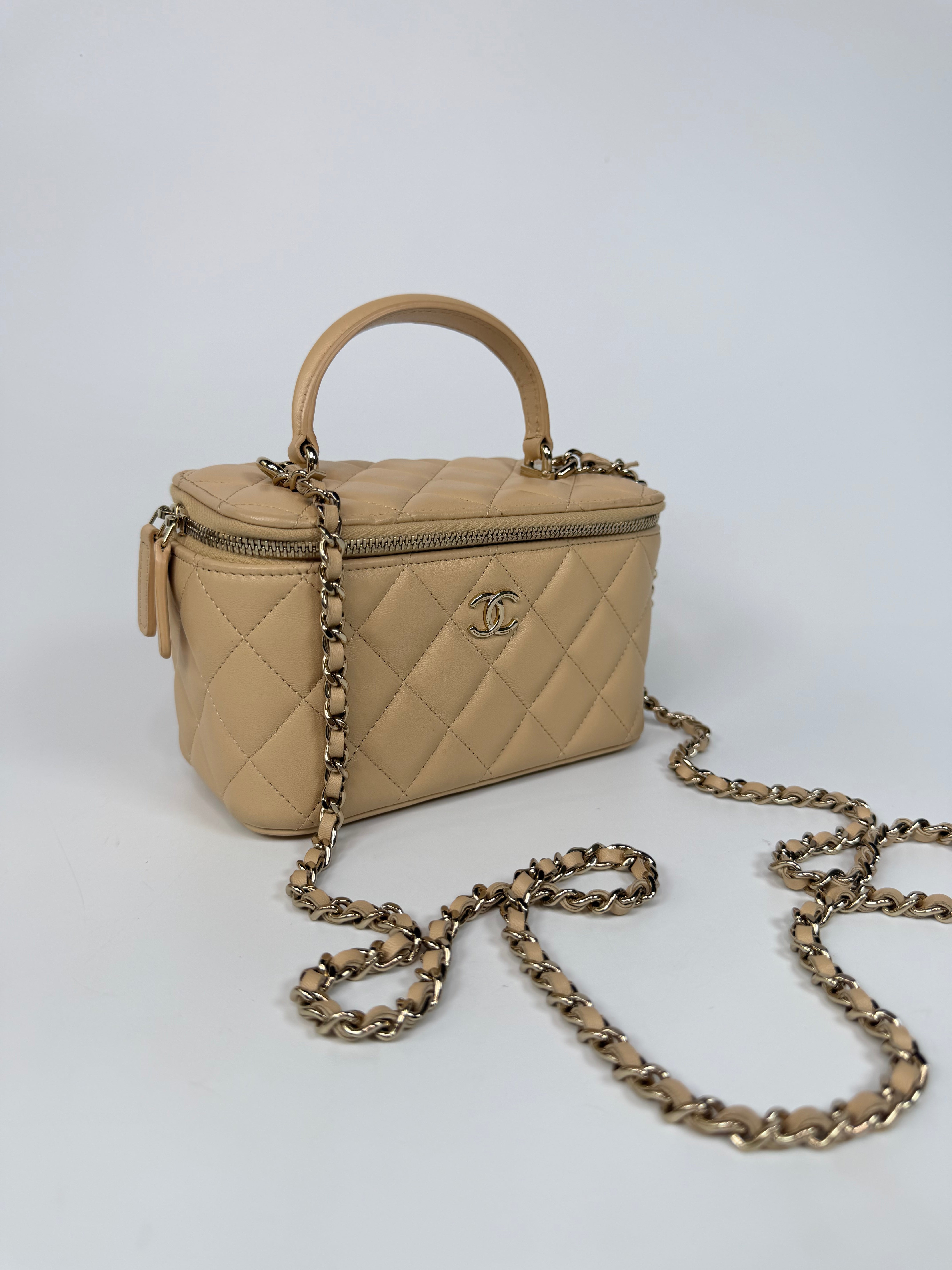 Chanel Mini Vanity Top Handle In Light Beige Lambskin Leather With Gold Hardware. Authentic and preloved in excellent condition. Insured next day delivery. Verified by Luxe Cheshire