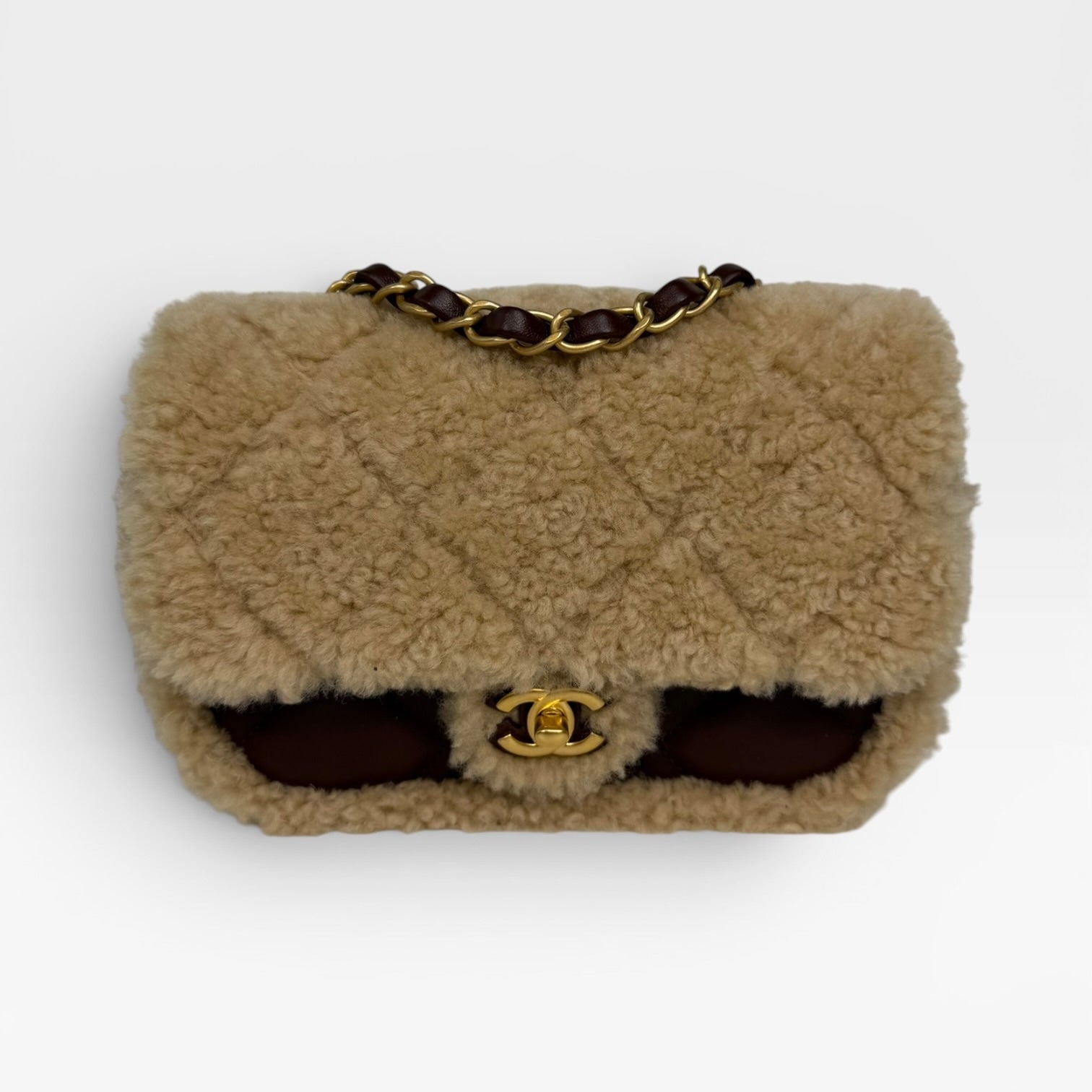 Chanel Mini Rectangle In Brown Lambskin Leather & Shearling With Gold Hardware. Authentic and preloved in excellent condition with 100% authenticity guarantee.