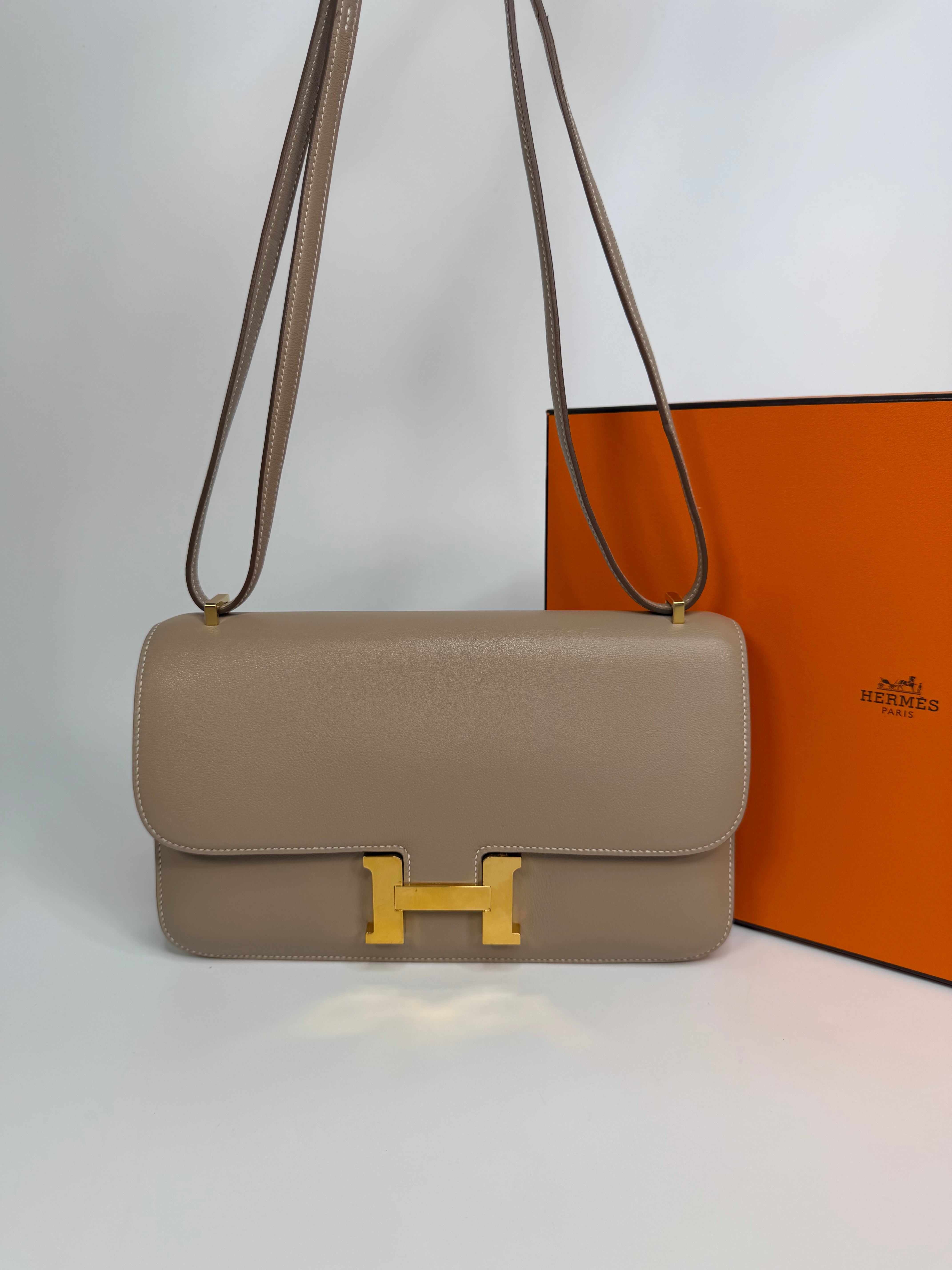 Hermès Constance Elan In Trench Swift Leather With Gold Hardware. Authentic and preloved in very good condition