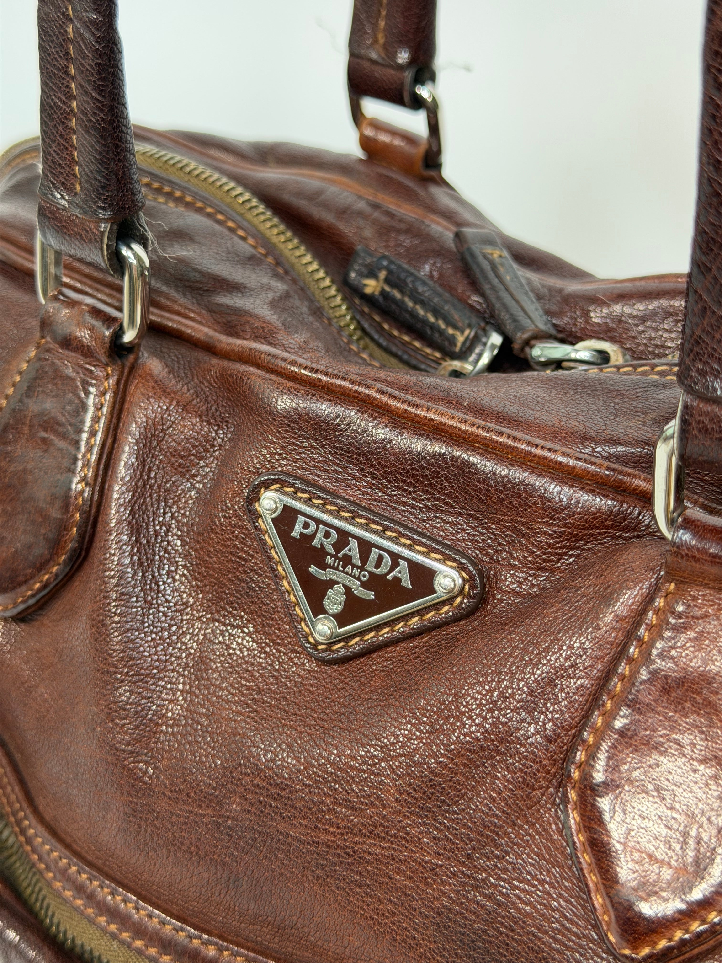 Prada Washed Bauletto Shoulder Bag In Brown Leather With Gold Hardware. Authentic and preloved in very good condition