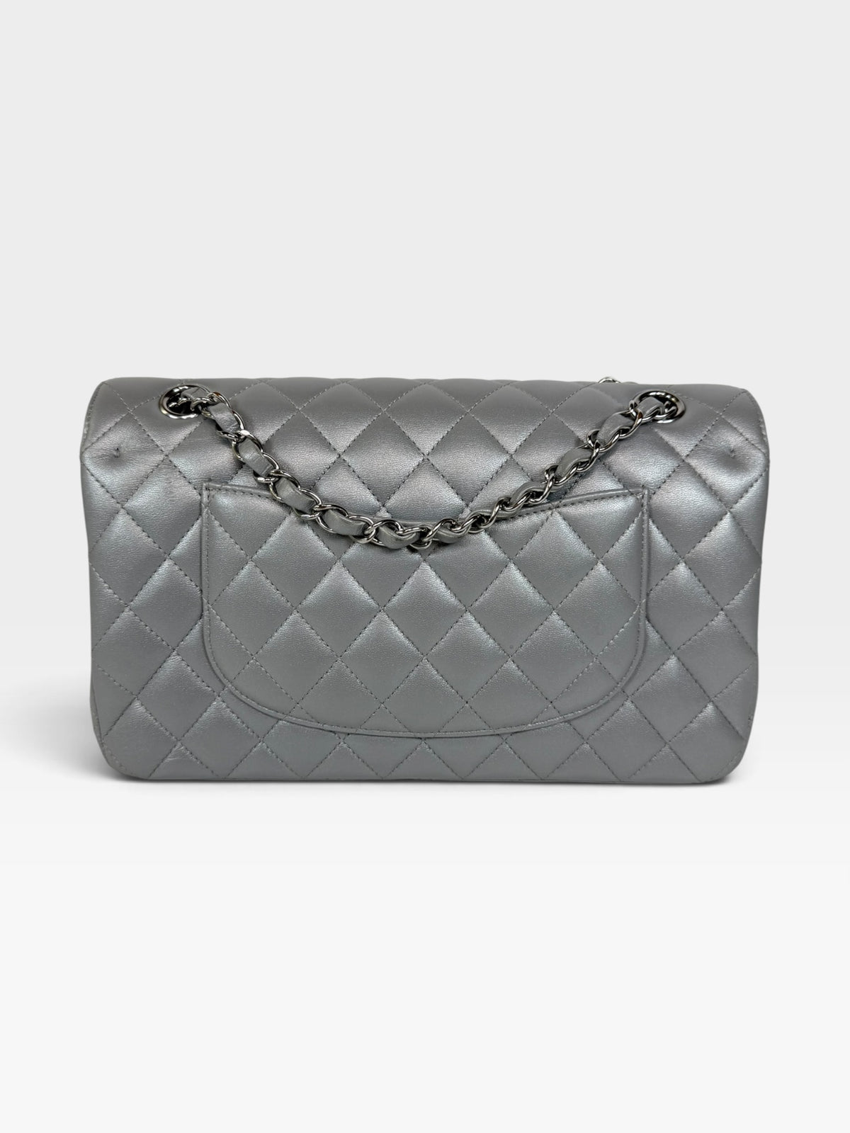 Chanel Medium Classic Double Flap In Silver Lambskin Leather Silver Hardware. 100% authentic and preloved in excellent condition