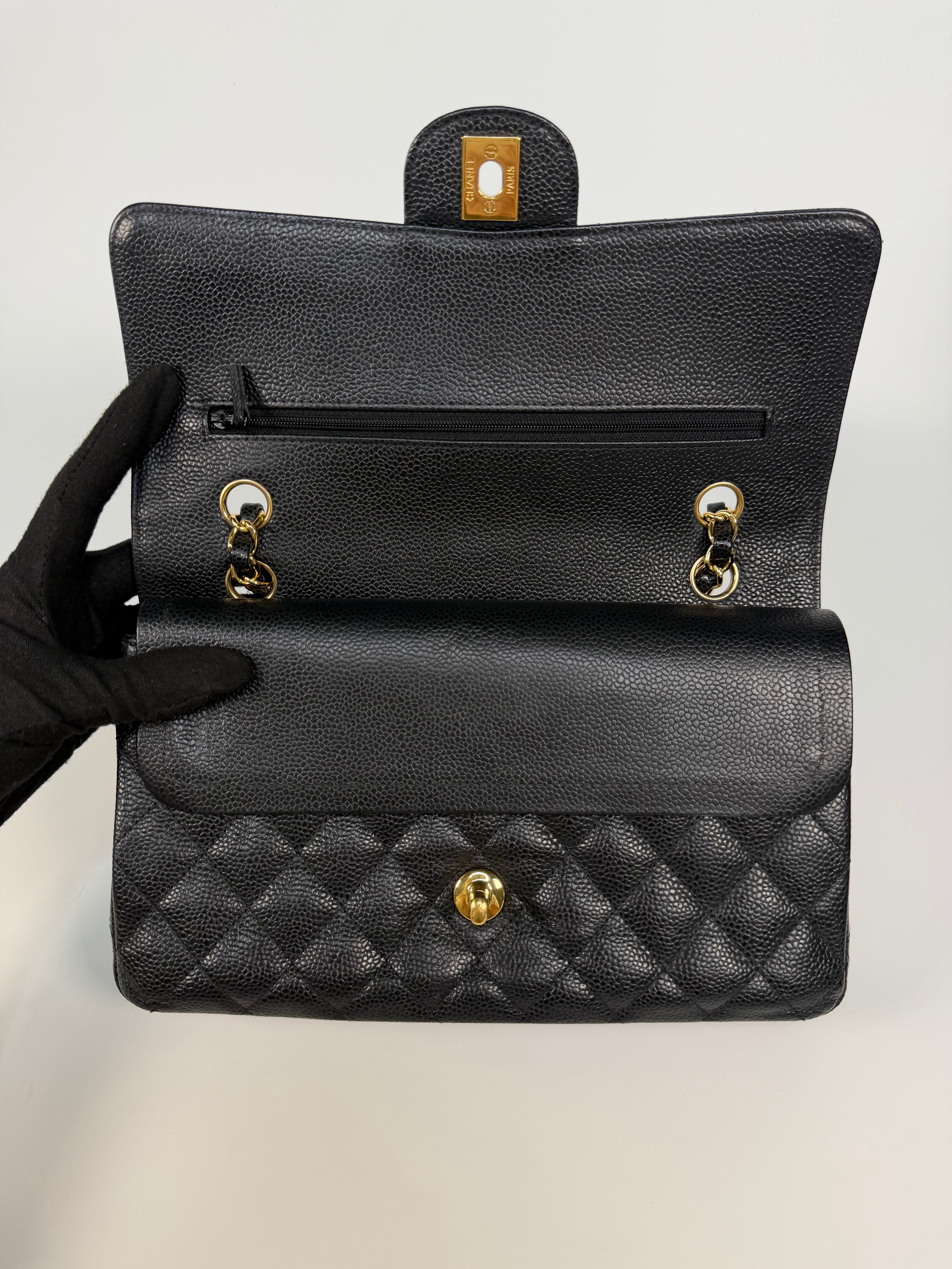 Chanel Medium Classic Double Flap In Black Caviar Leather Gold Hardware. 100% authentic and preloved in excellent condition