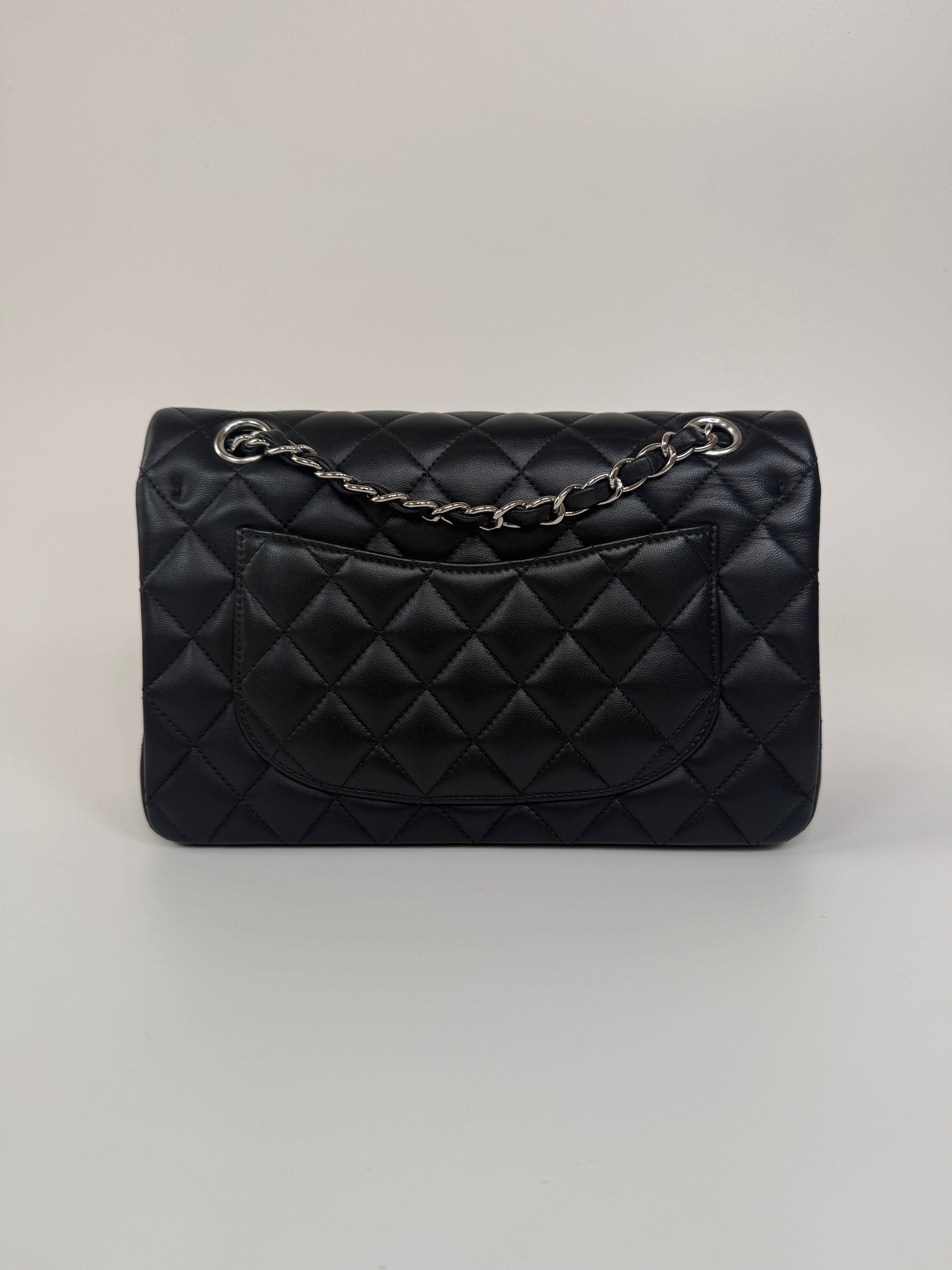 Chanel Small Classic Double Flap In Black Lambskin Leather With Silver Hardware Authentic and preloved in excellent condition. 100% Authenticity guarantee