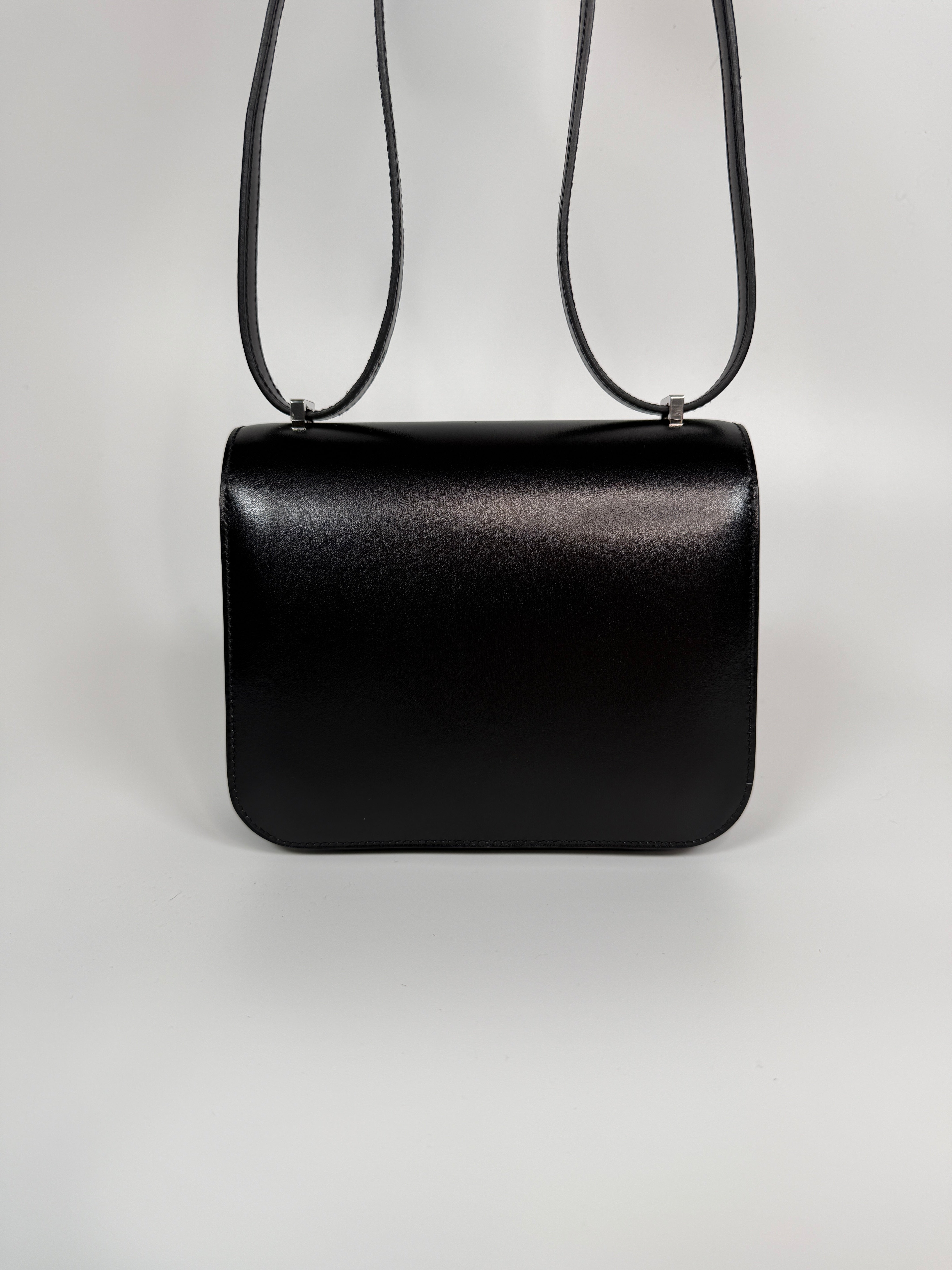 Authentic and preloved Hermès Constance 18 In Black Box Leather With Palladium Hardware. 100% Authenticity guarantee.