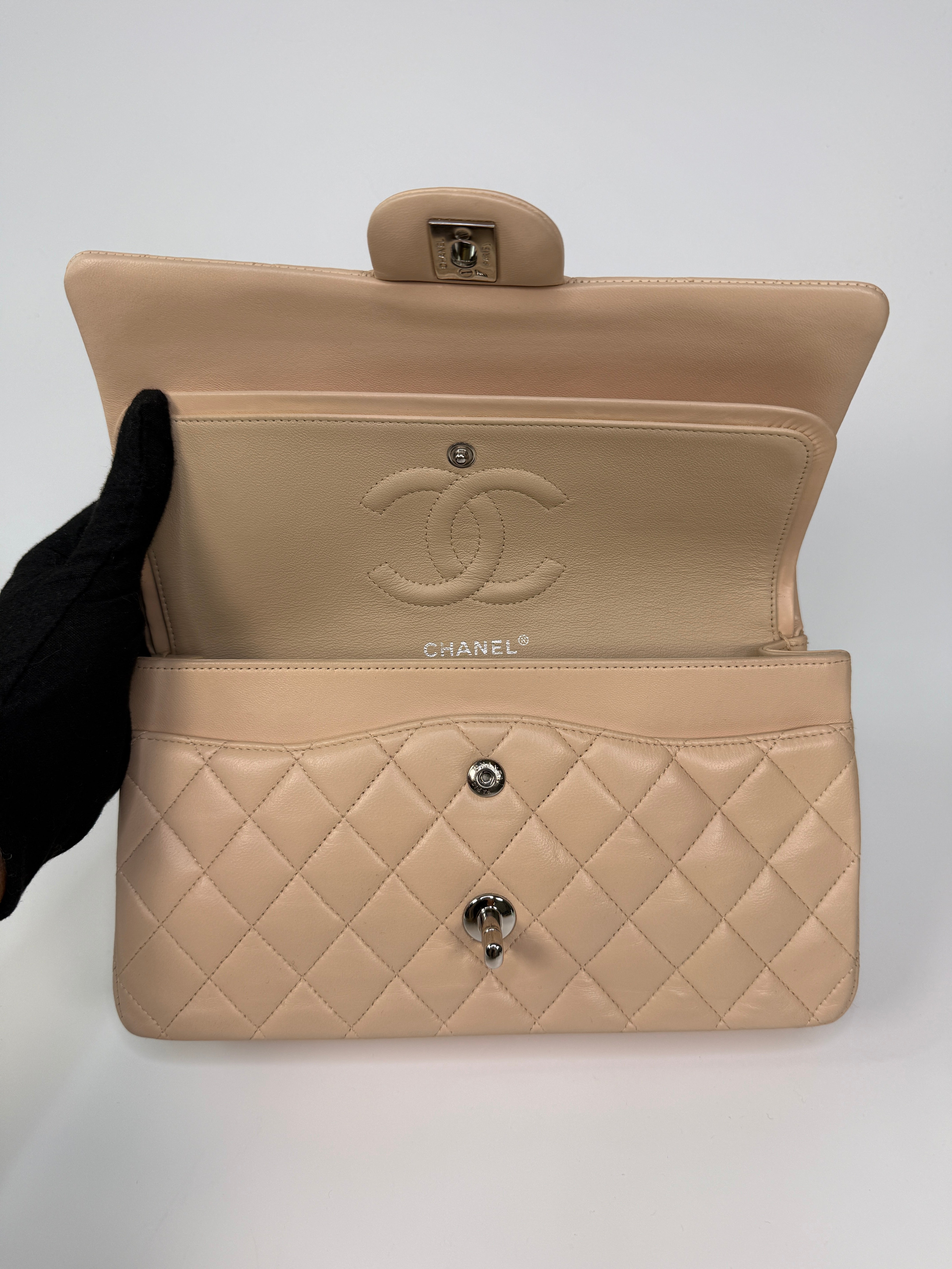 Authentic and preloved Chanel Medium Classic Double Flap Light Beige Lambskin Leather With Silver Hardware