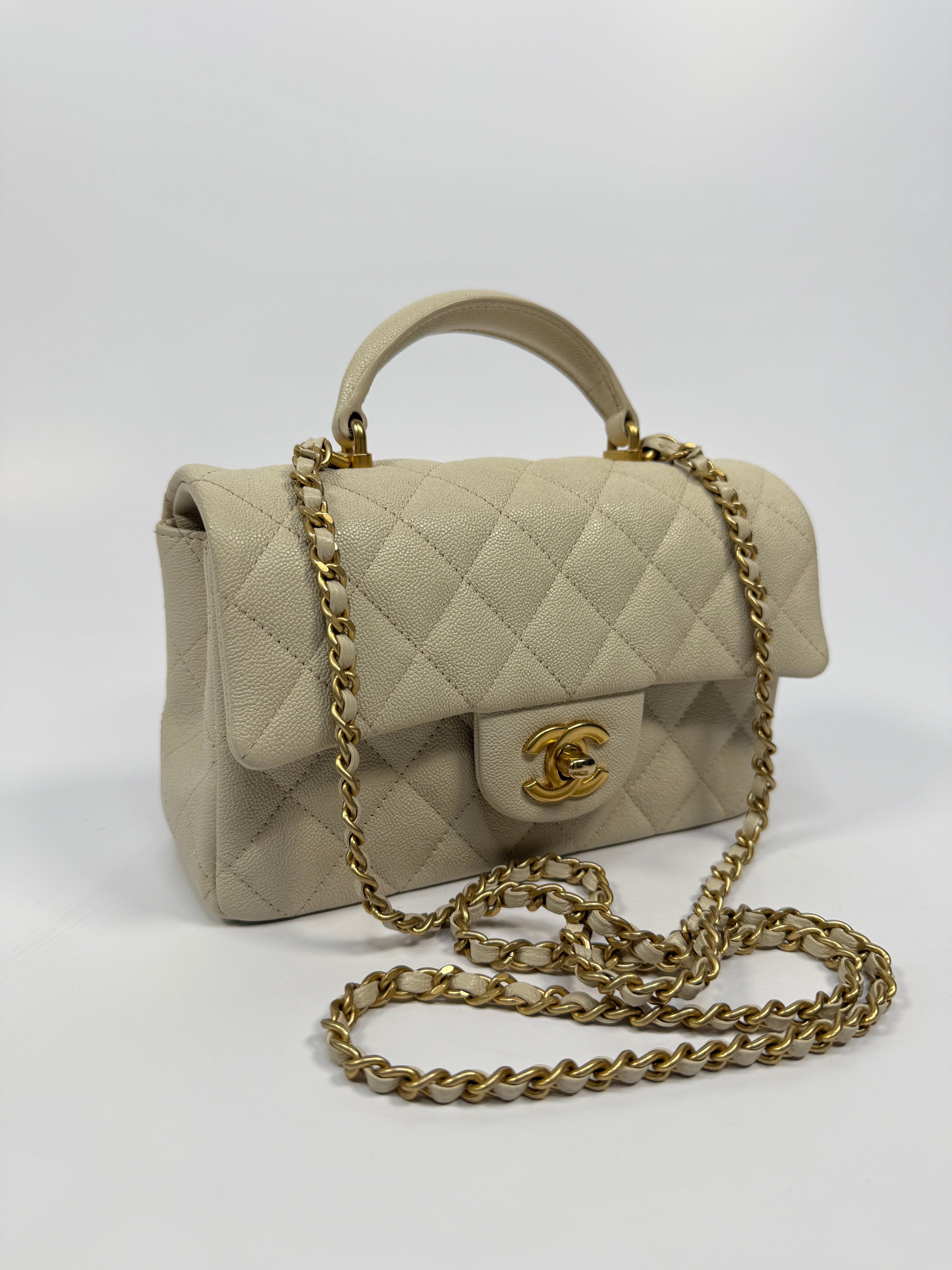 Chanel Mini Rectangle Top Handle In Ecru Caviar With Gold hardware, authentic and preloved in excellent condition