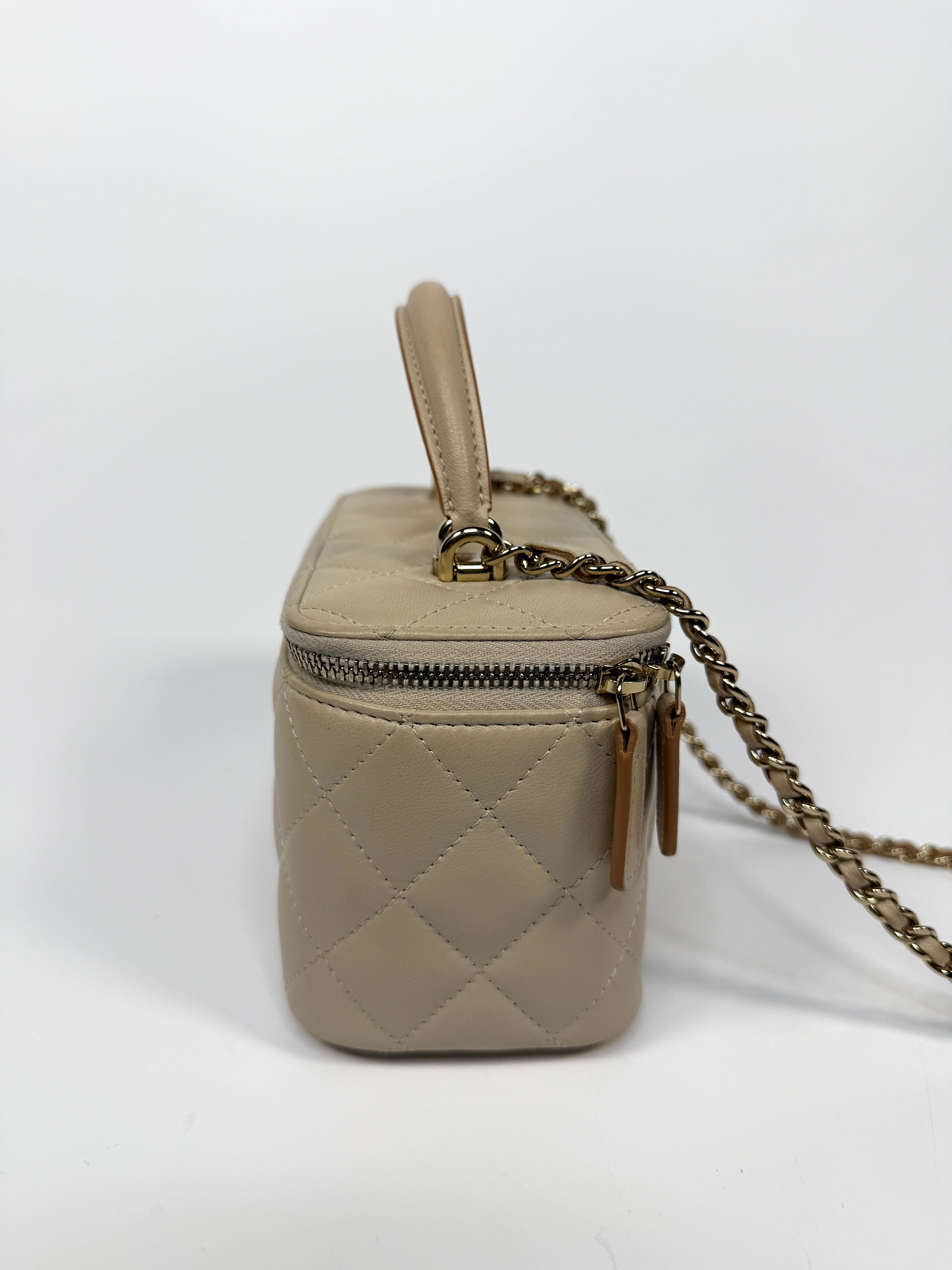 Chanel Vanity Rectangular Top Handle Ecru/Beige Lambskin With Gold Hardware Authentic and preloved. Excellent condition.