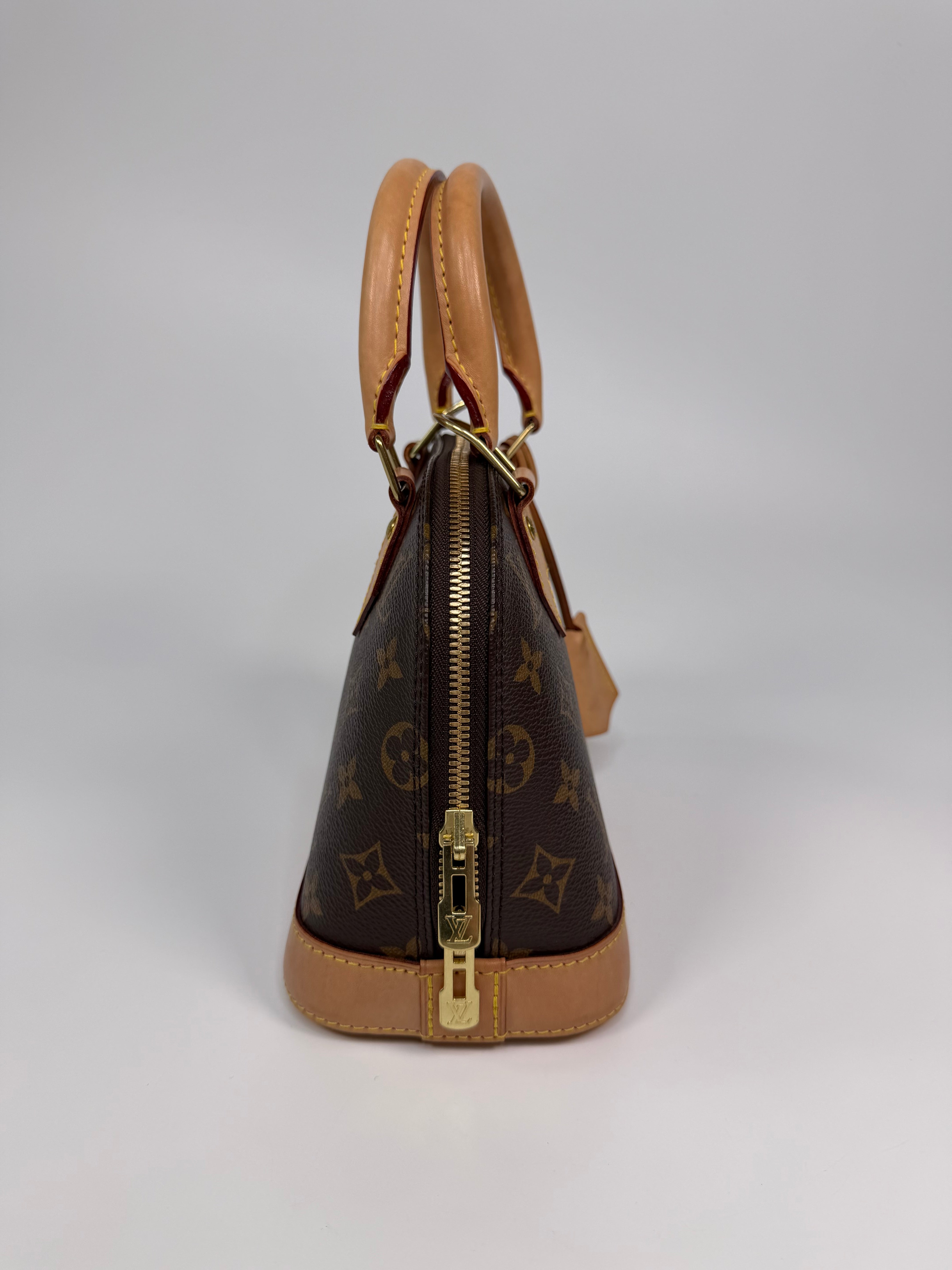Louis Vuitton Alma BB In Brown Monogram Canvas With Gold Hardware. Authentic and preloved in very good condition