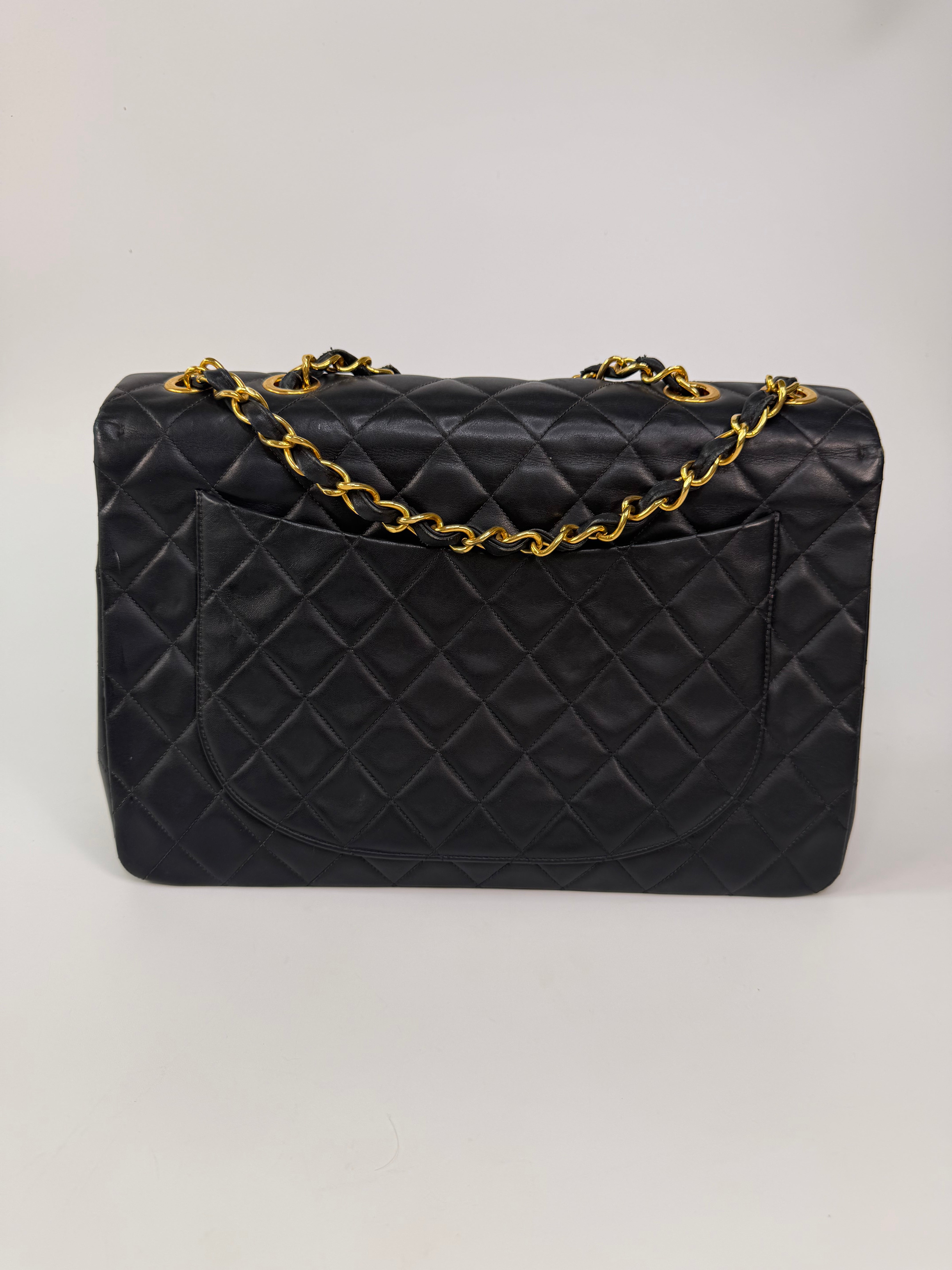 Chanel Vintage XL Maxi Flap Bag In Black Lambskin Gold Hardware. 100% authentic and preloved in excellent condition