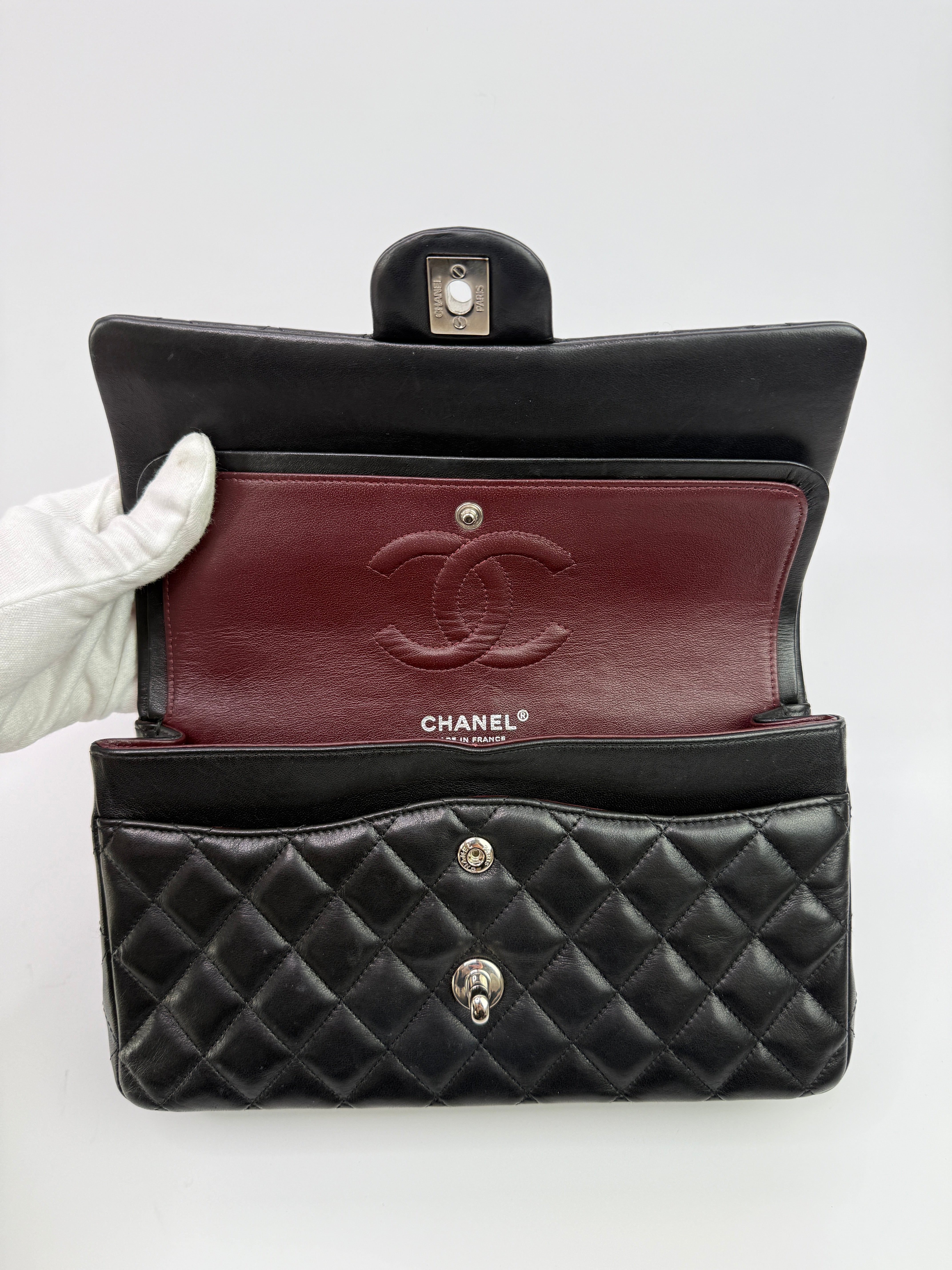 Authentic and preloved Chanel Medium Classic Double Flap Black Lambskin With Silver hardware Excellent condition. 100% Authenticity guarantee