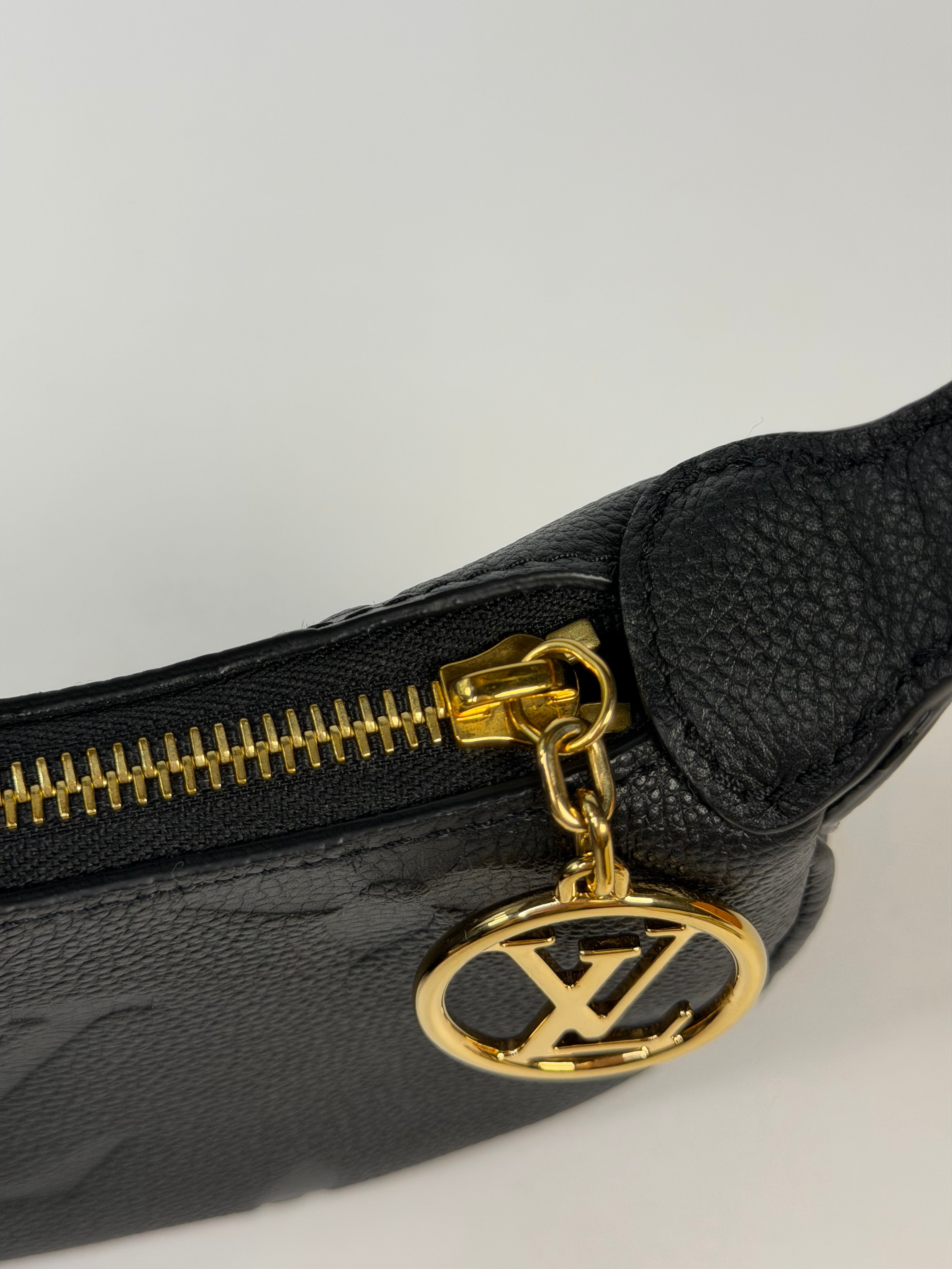 Louis Vuitton Mini Moon Bag In Black Leather With Gold Hardware in excellent condition 100% authentic and preloved