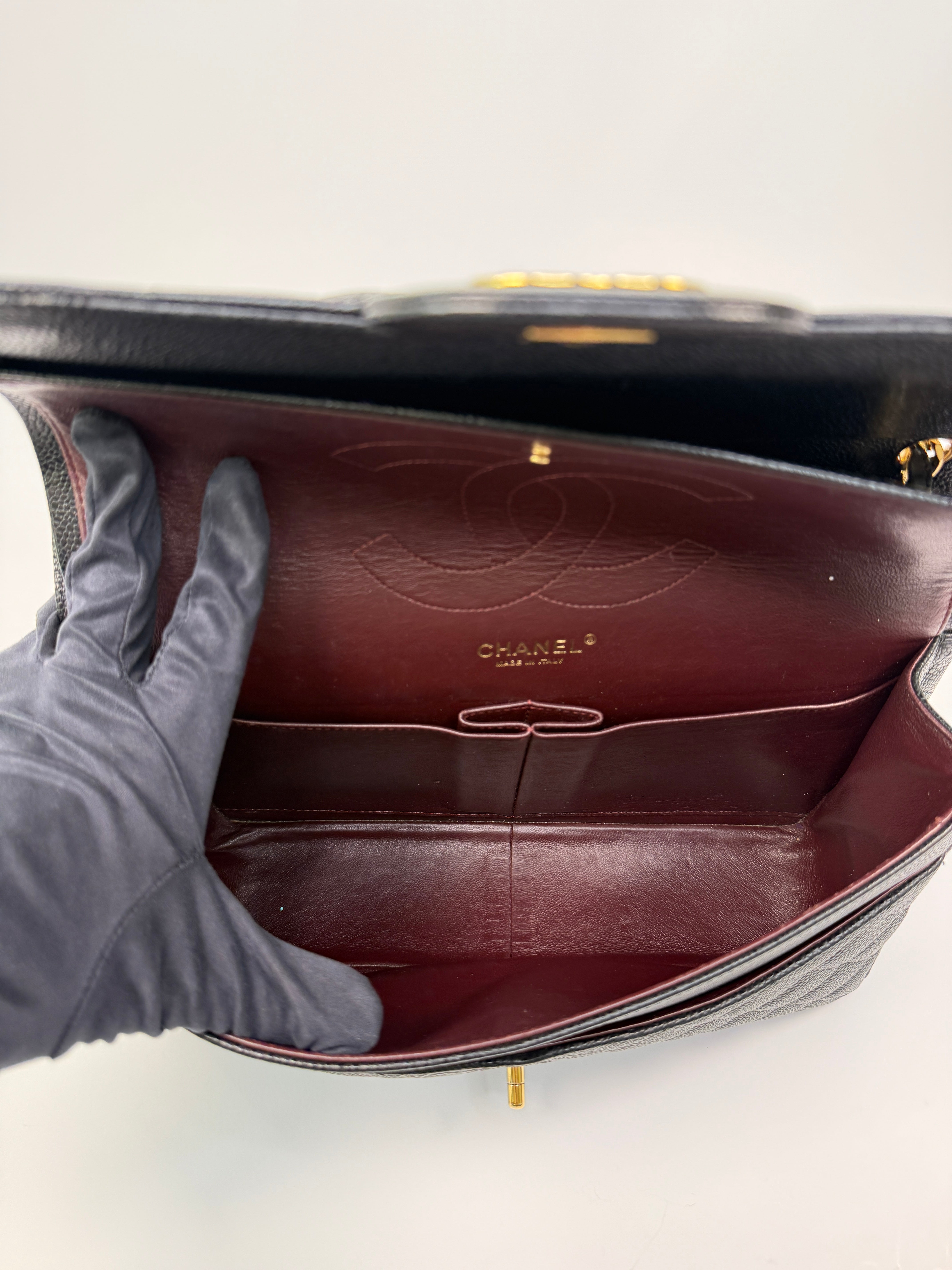 Chanel Classic Jumbo Flap Bag In Black Caviar LeatherWith Gold Hardware
Pre Loved & Authentic