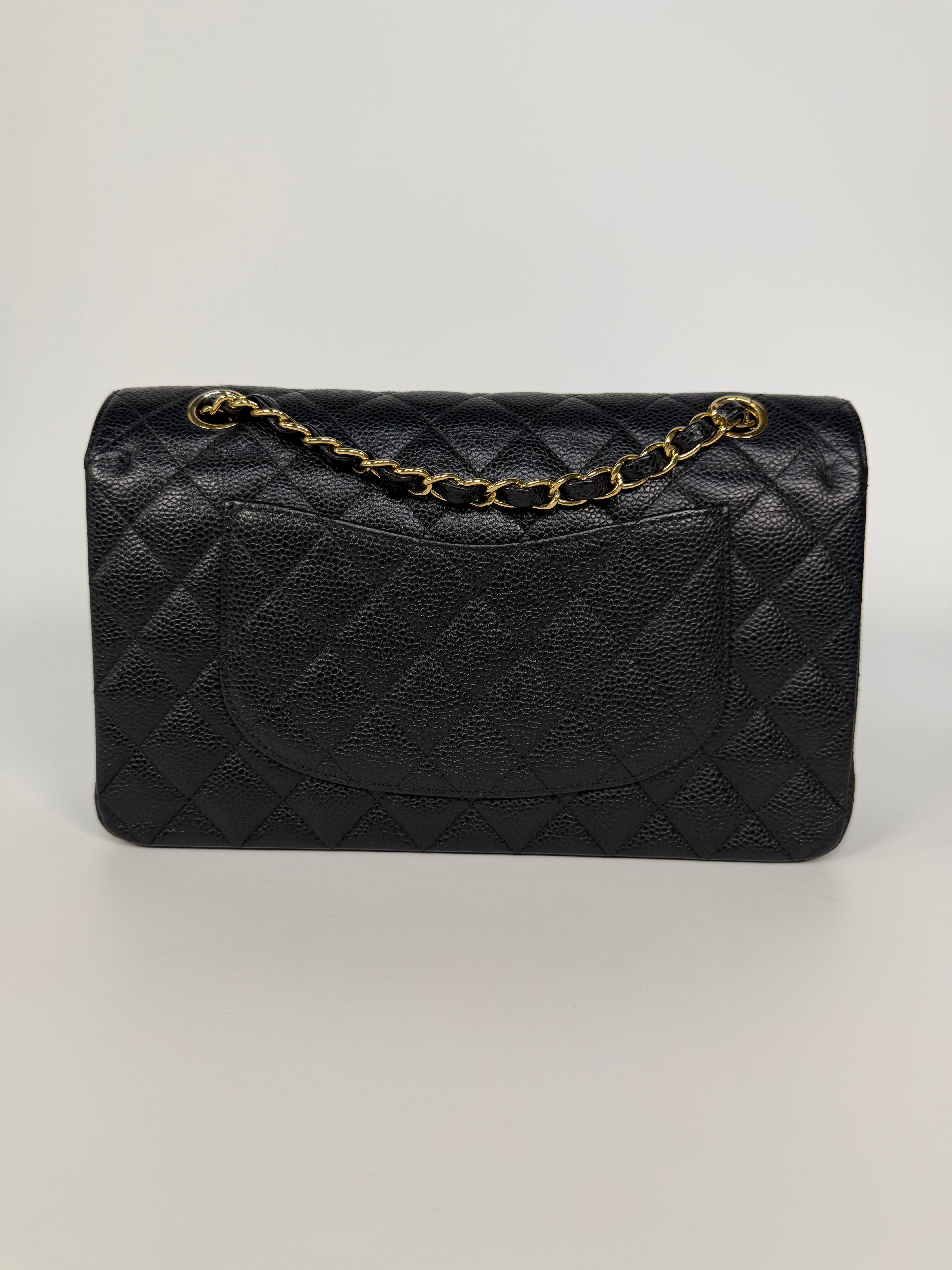 Chanel Medium Classic Double Flap In Black Caviar Leather Gold Hardware. 100% authentic and preloved in excellent condition