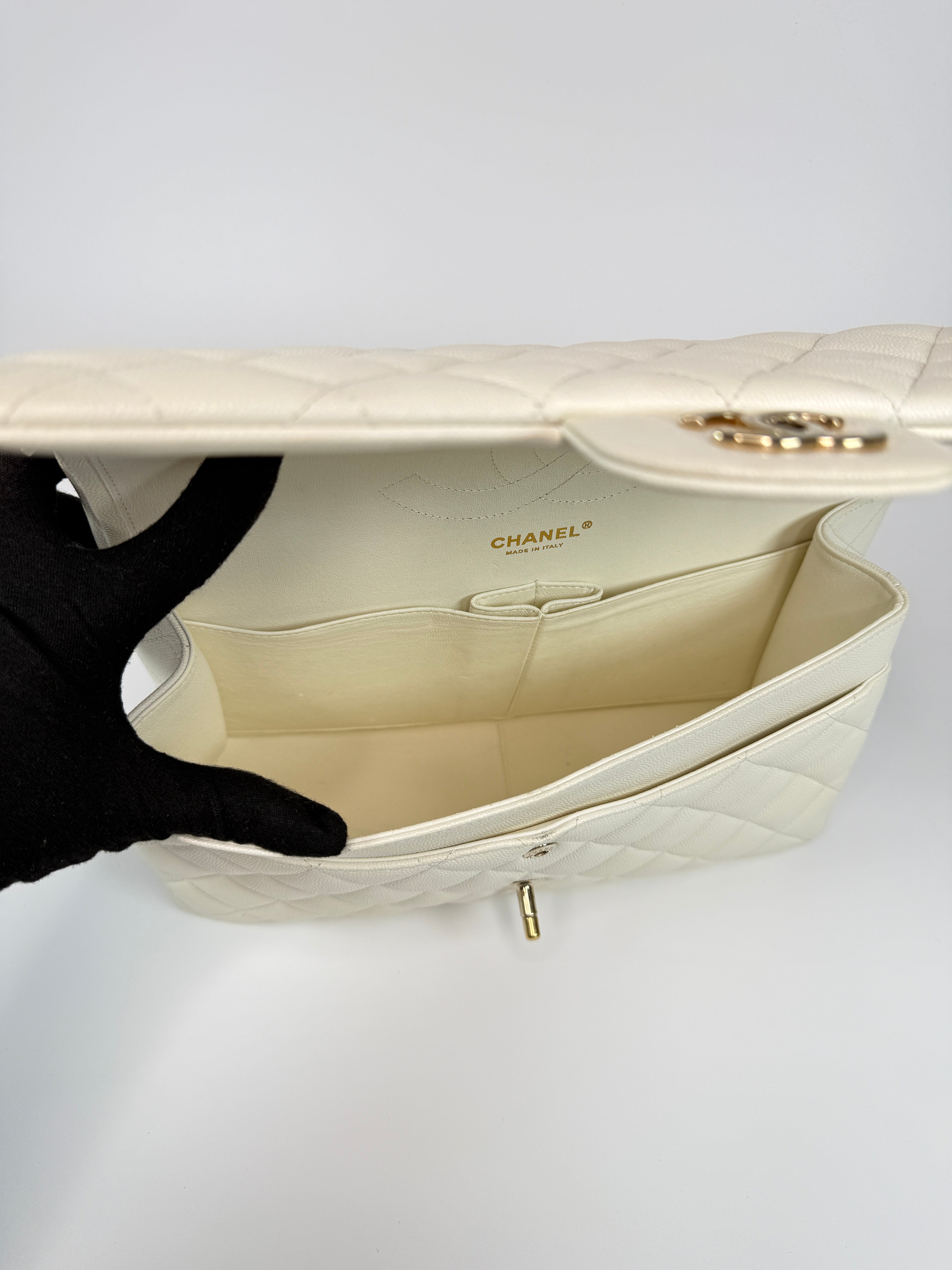 Authentic pre-loved Chanel Classic Jumbo Flap Bag In White Caviar Leather With pale gold hardware in very good condition. Verified by Luxe Cheshire. International, fast and fully insured delivery. Trusted designer resale.