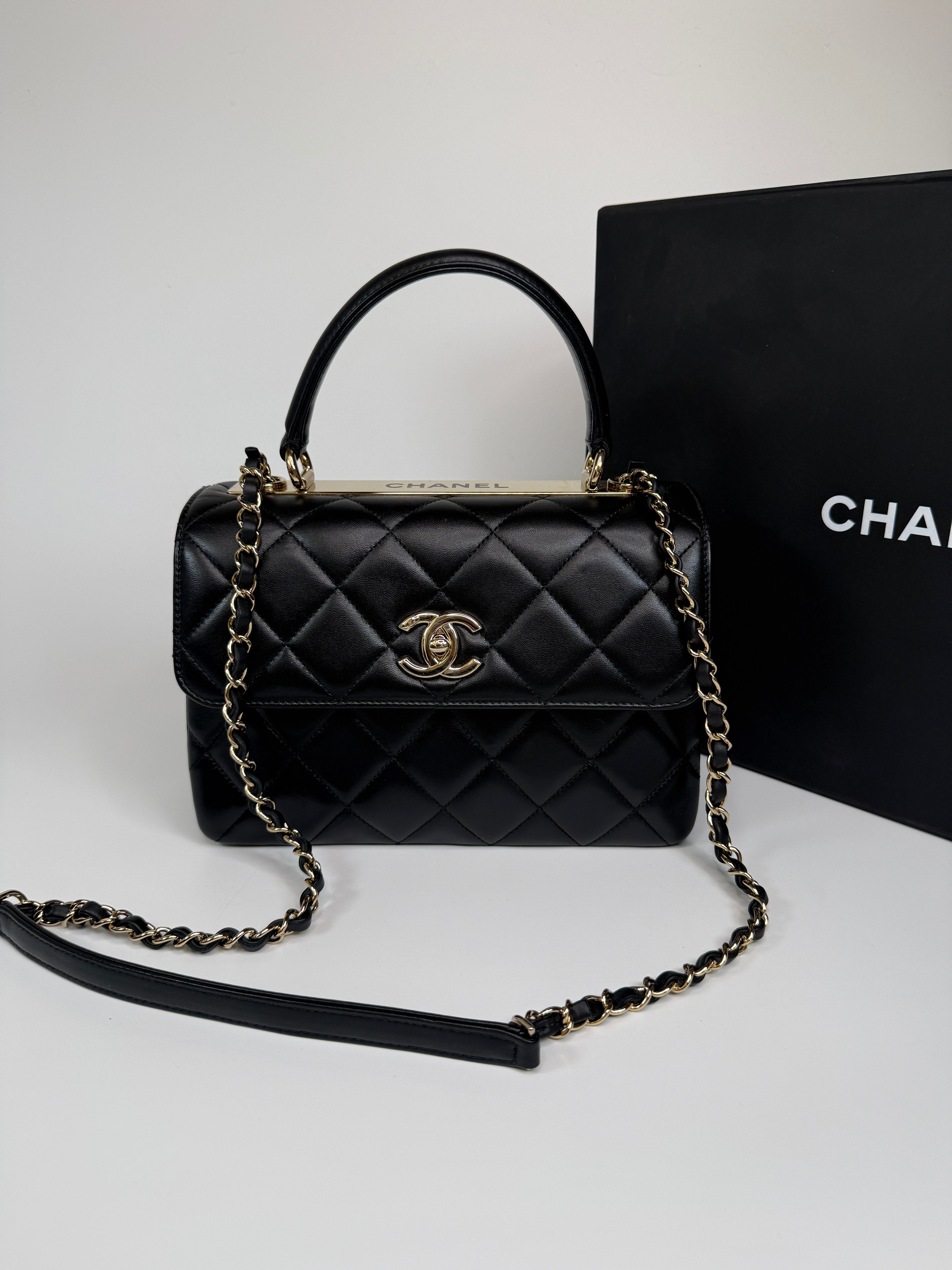 Authentic and preloved Chanel Trendy Top Handle Flap Bag In Black Lambskin With Gold Hardware. Excellent condition. 100% Authenticity guarantee