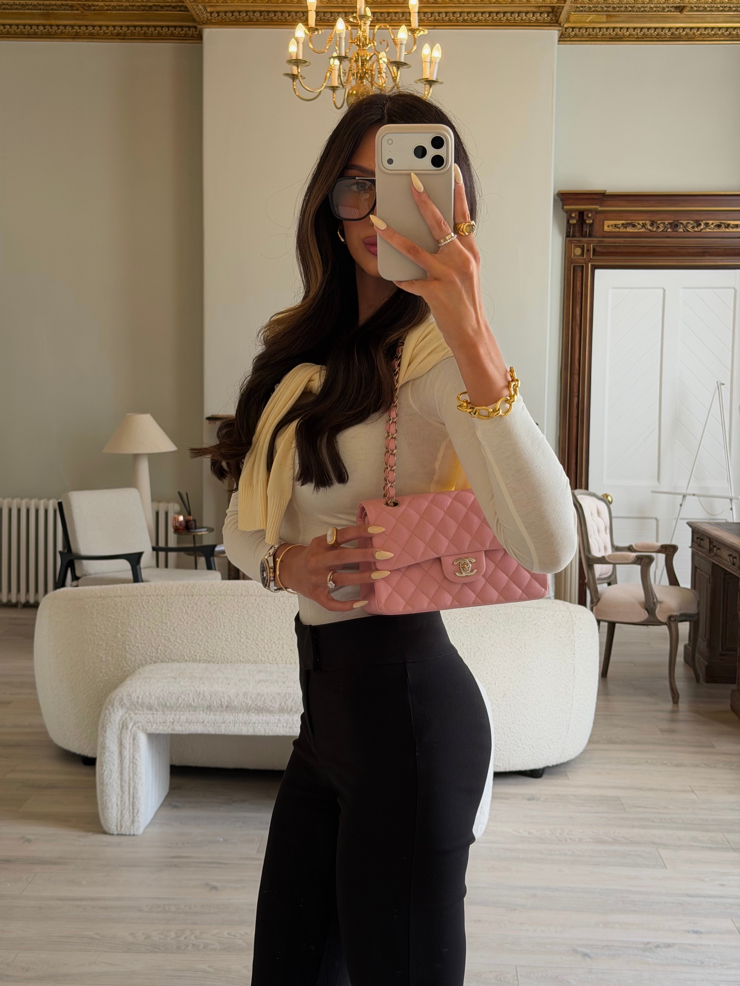 Authentic pre-loved Chanel Small Classic Double Flap In Pink Caviar Leather With Gold Hardware.