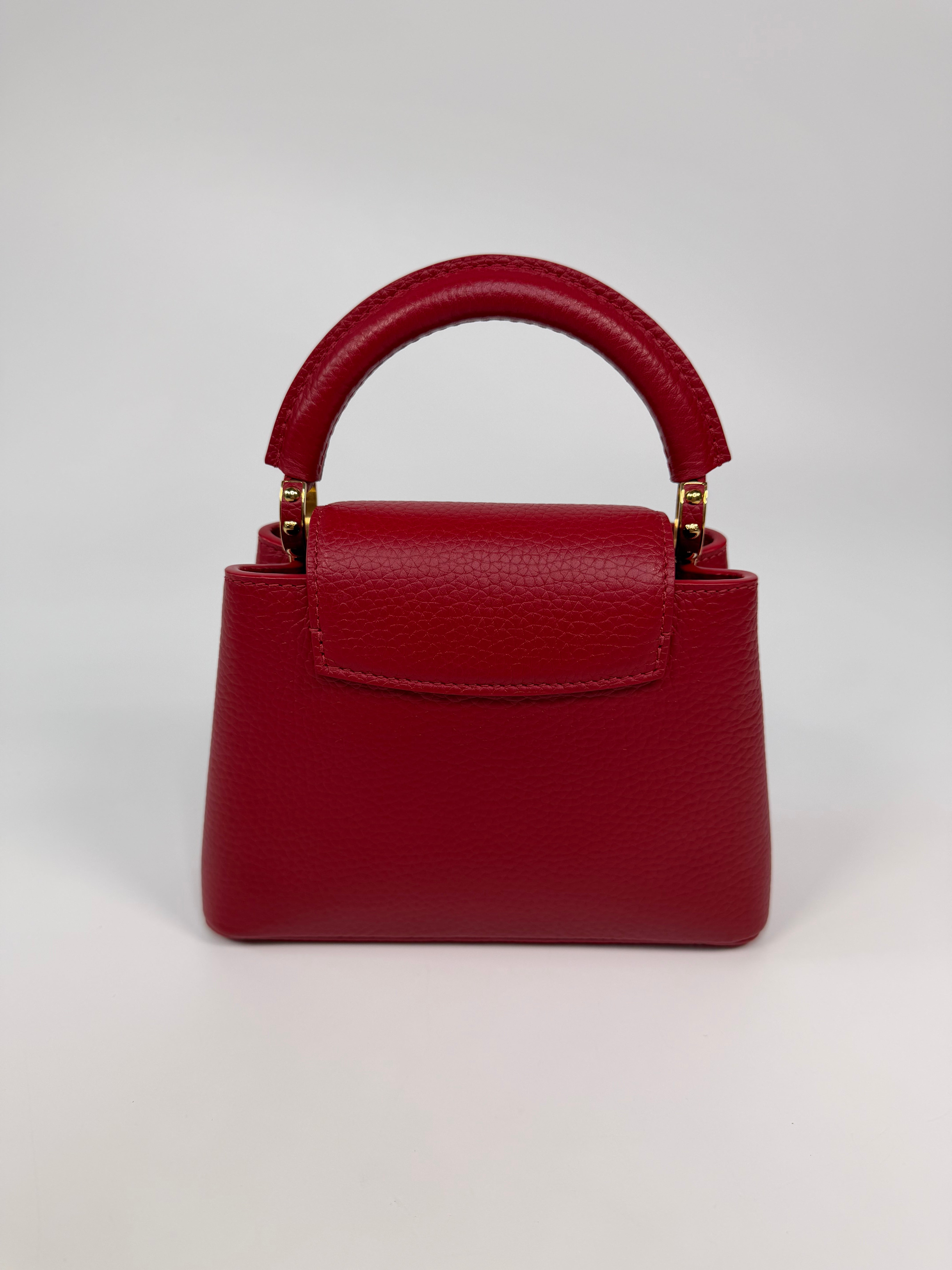 Louis Vuitton Capucines BB Bag In Scarlet Taurillion Leather With Gold Hardware. Authentic and preloved in excellent condition