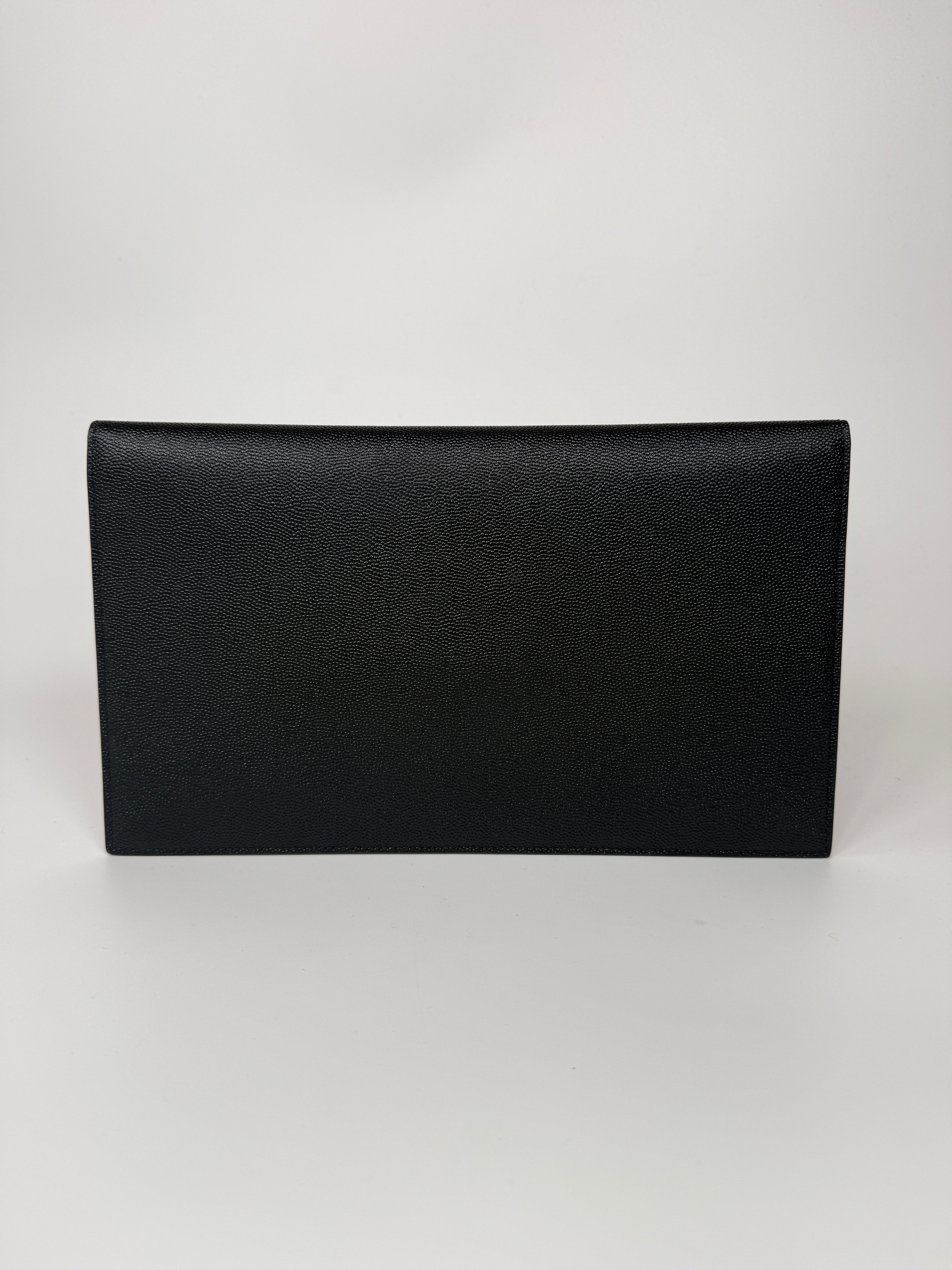 Saint Laurent Uptown Clutch In Black Leather With Gold Hardware. Authentic and preloved, 100% authenticity guarantee