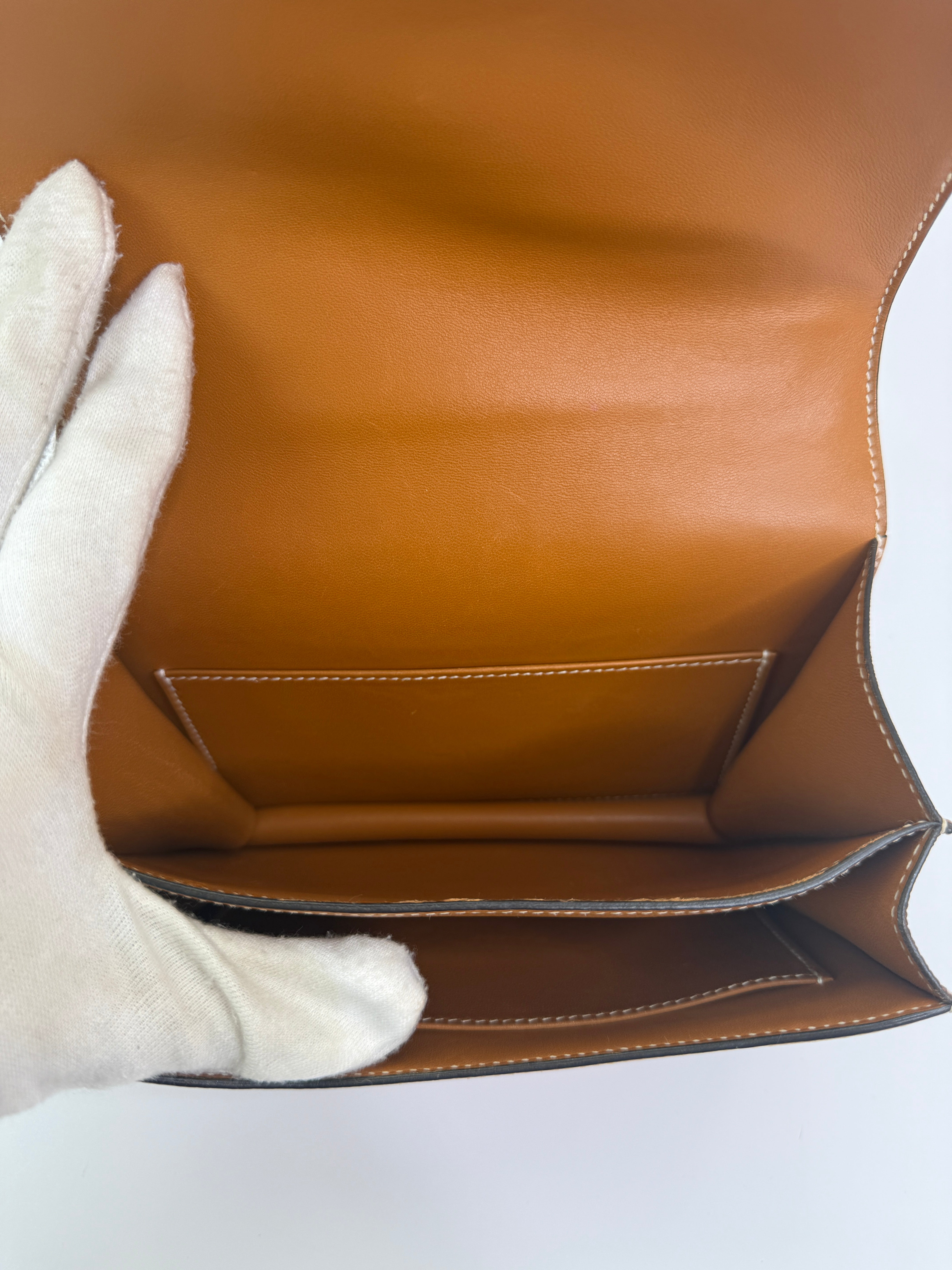 Authentic pre-lovedHermès Constance 18 In Toffee Epsom Leather With Gold Hardware.