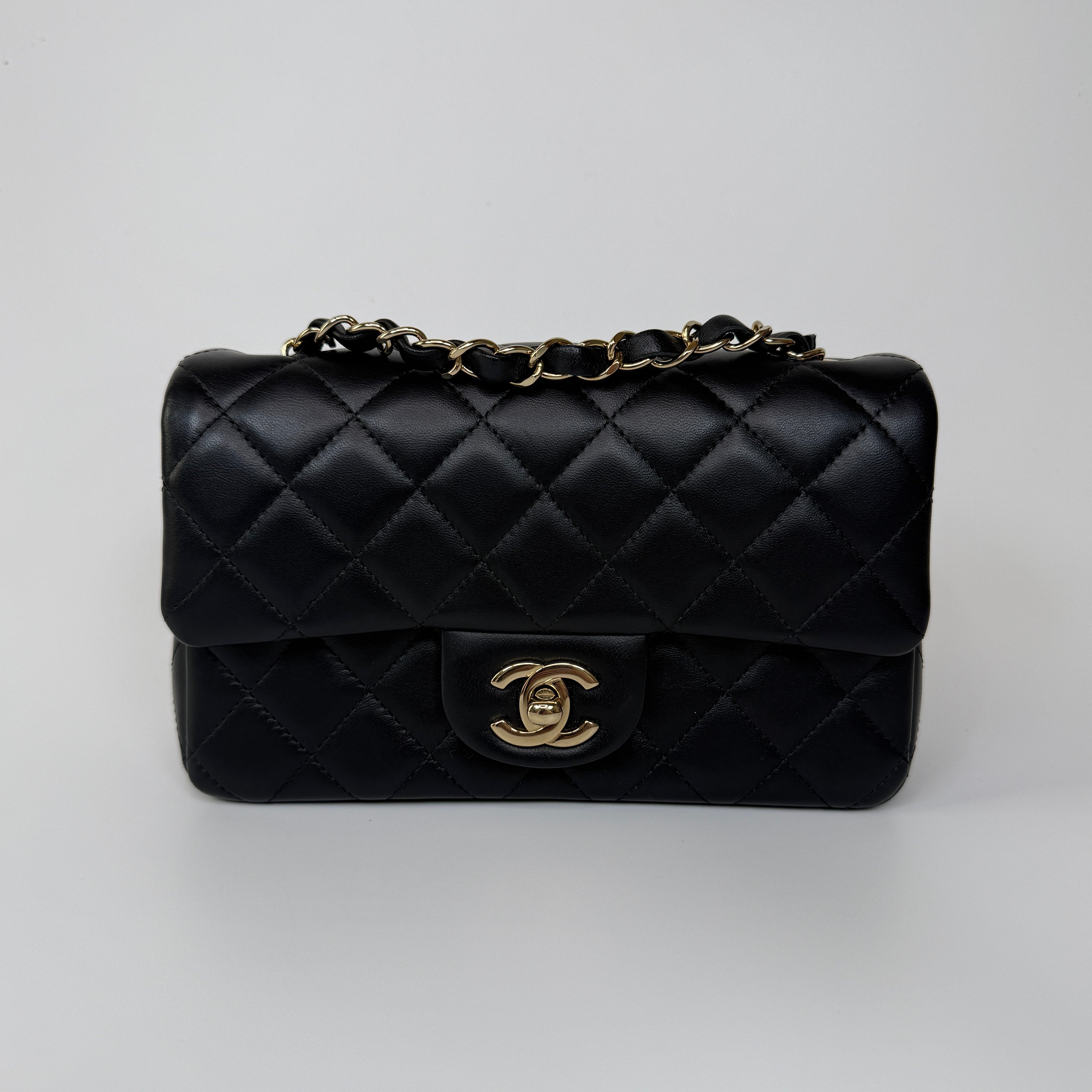 Authentic and preloved Chanel Mini Rectangle Flap Bag In Black Lambskin Leather With Pale Gold Hardware. Excellent condition. 100% Authenticity guarantee