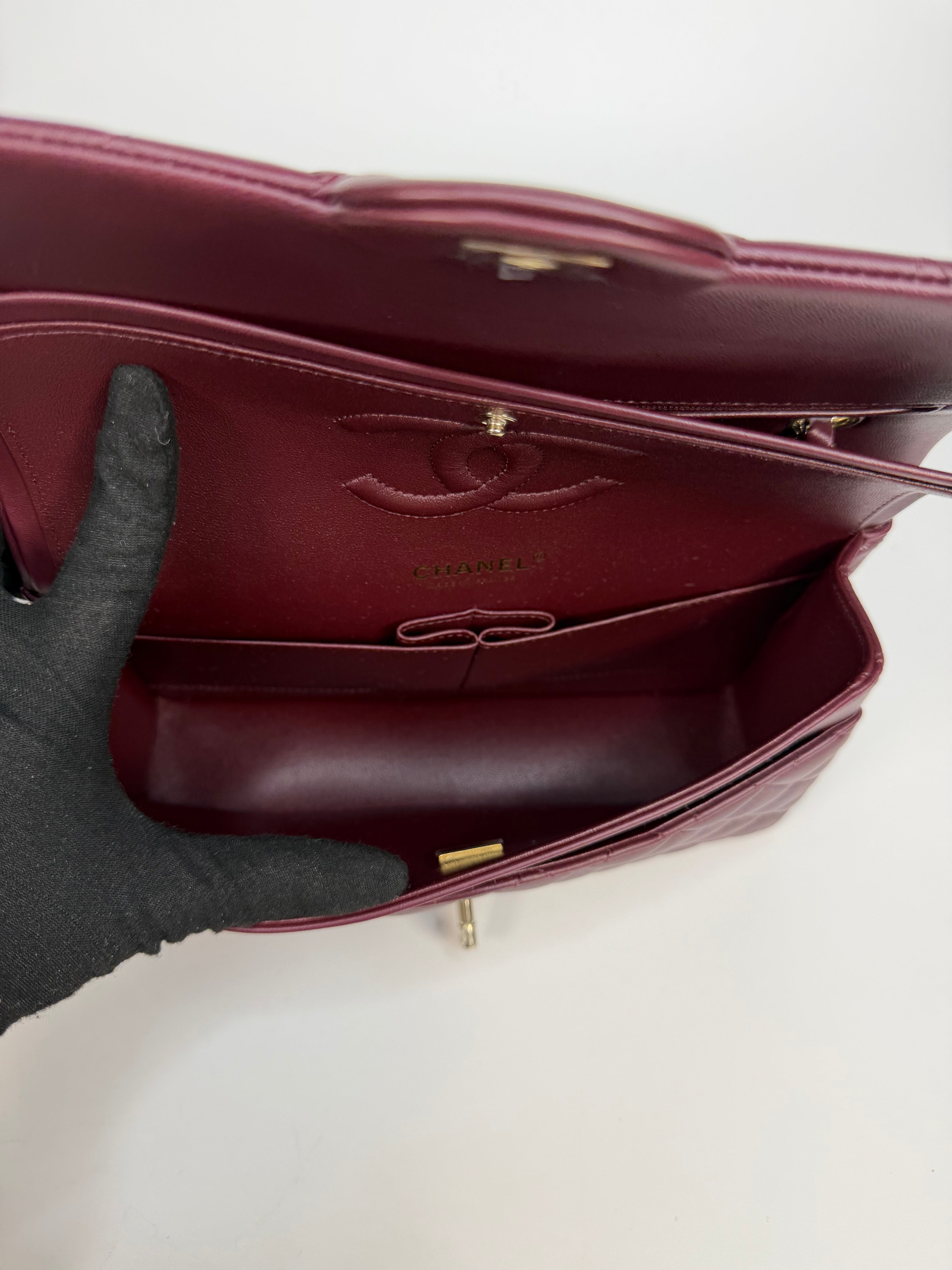 Chanel Medium Classic Double Flap Burgundy Lambskin Leather With Pale Gold Hardware. Authentic and preloved in excellent condition with 100% authenticity guarantee.
