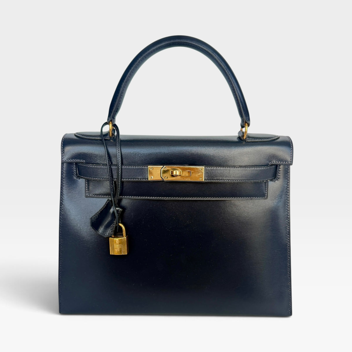 Hermès Vintage Kelly 28 In Navy Sellier Box Leather With Gold Hardware. 100% authentic and preloved in excellent condition.