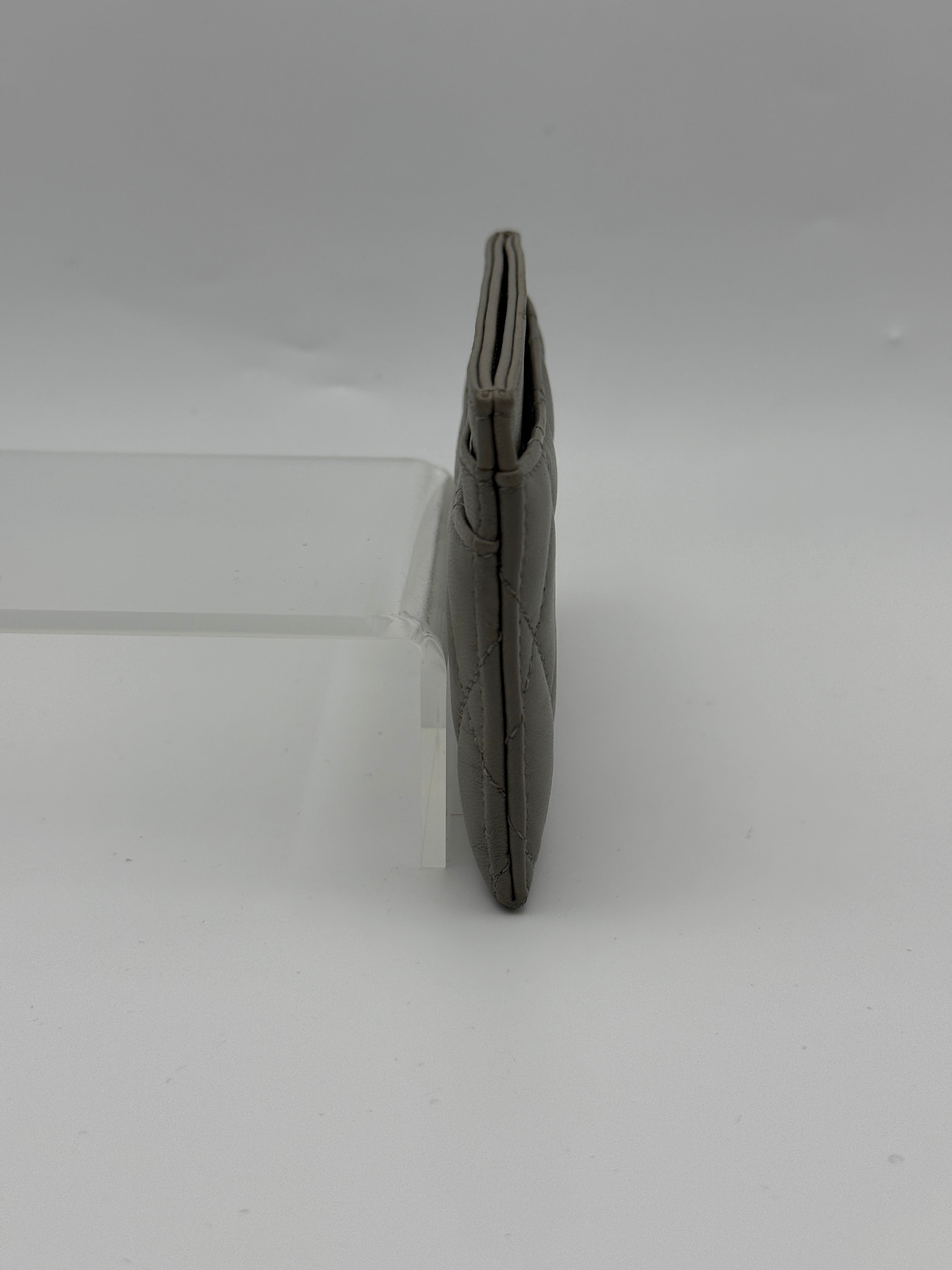 Authentic and pre loved Chanel Classic Card Holder In Grey Lambskin Leather With Silver hardware. Excellent Condition. 100% Authenticity guarantee.