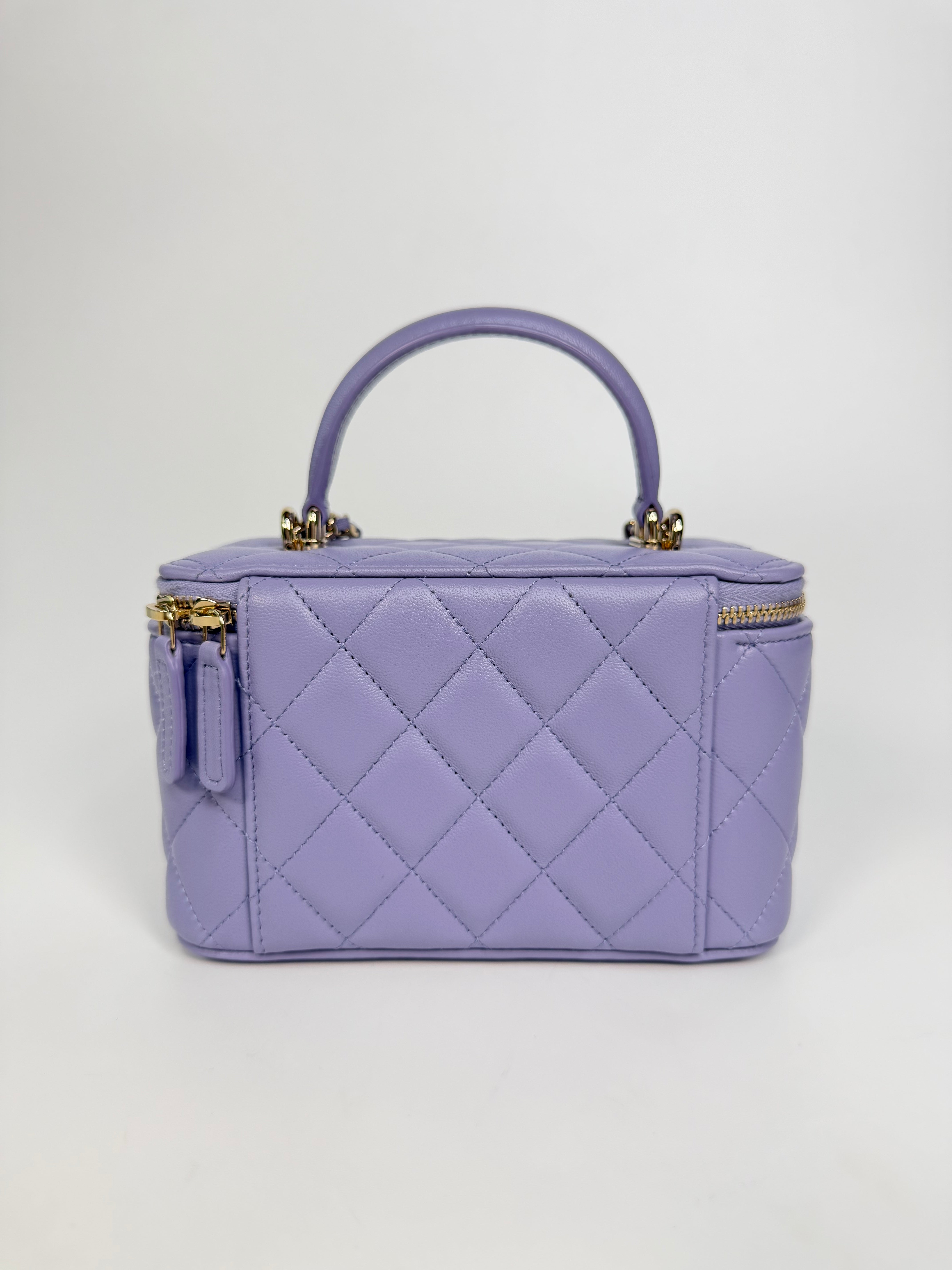 Chanel Mini Vanity Top Handle In Lilac Lambskin Leather With Gold Hardware. Authentic and preloved in excellent condition