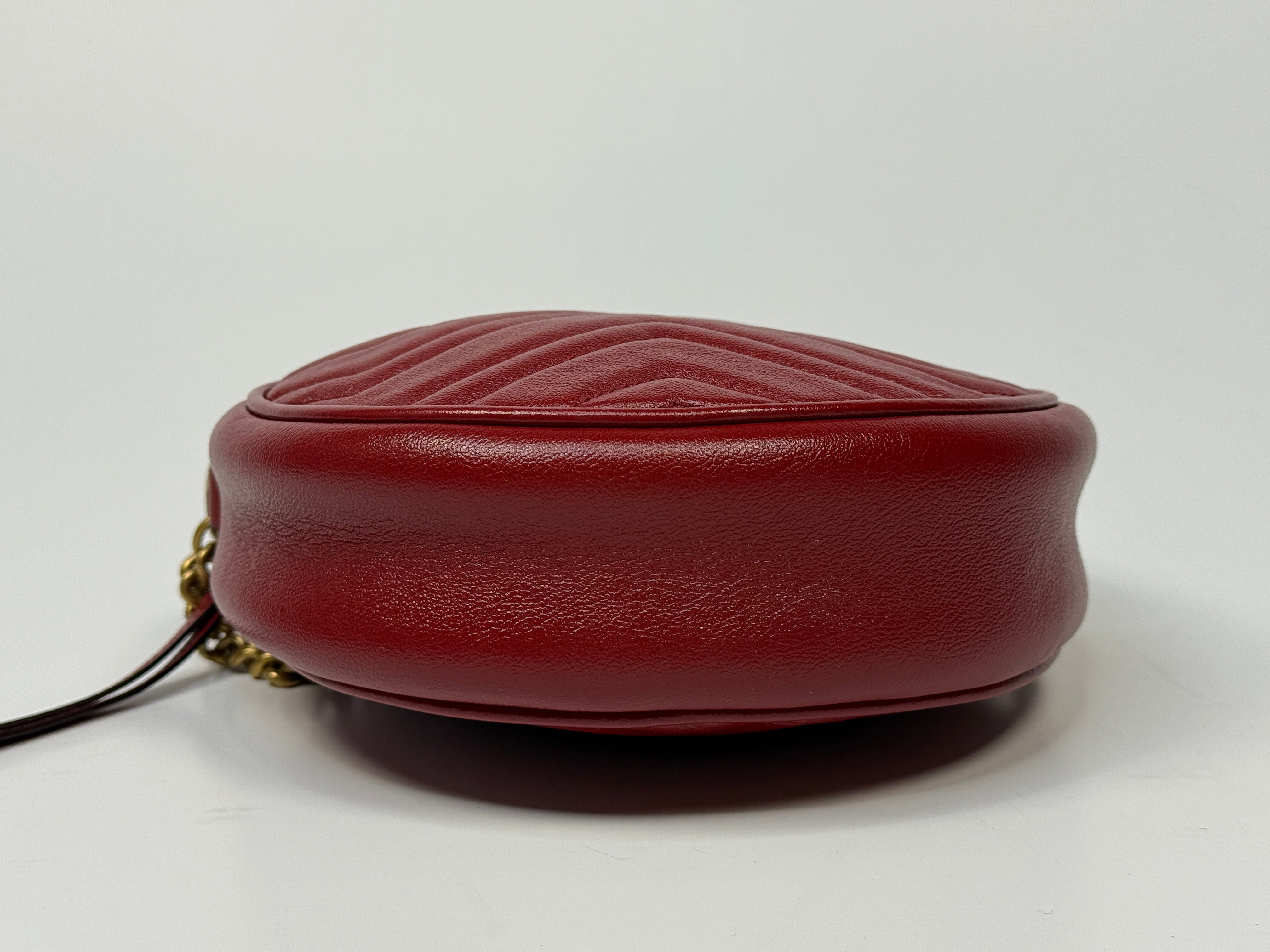 Gucci GG Marmont Round Shoulder Bag In Red Leather, very good condition. Authentic and preloved. 100% Authenticity guarantee