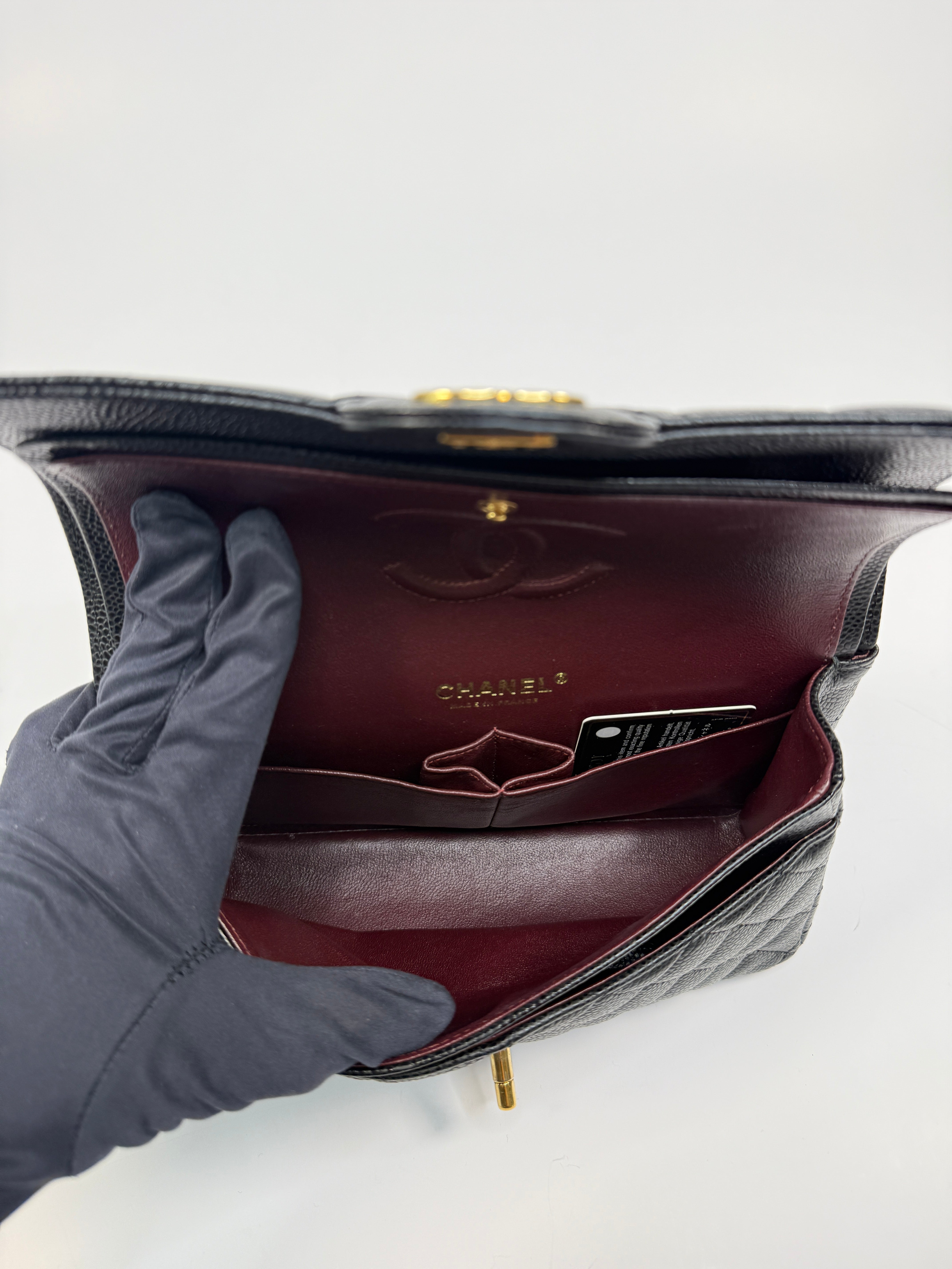 Chanel Small Classic Double Flap In Black Caviar Leather With Gold Hardware
Pre Loved & Authentic