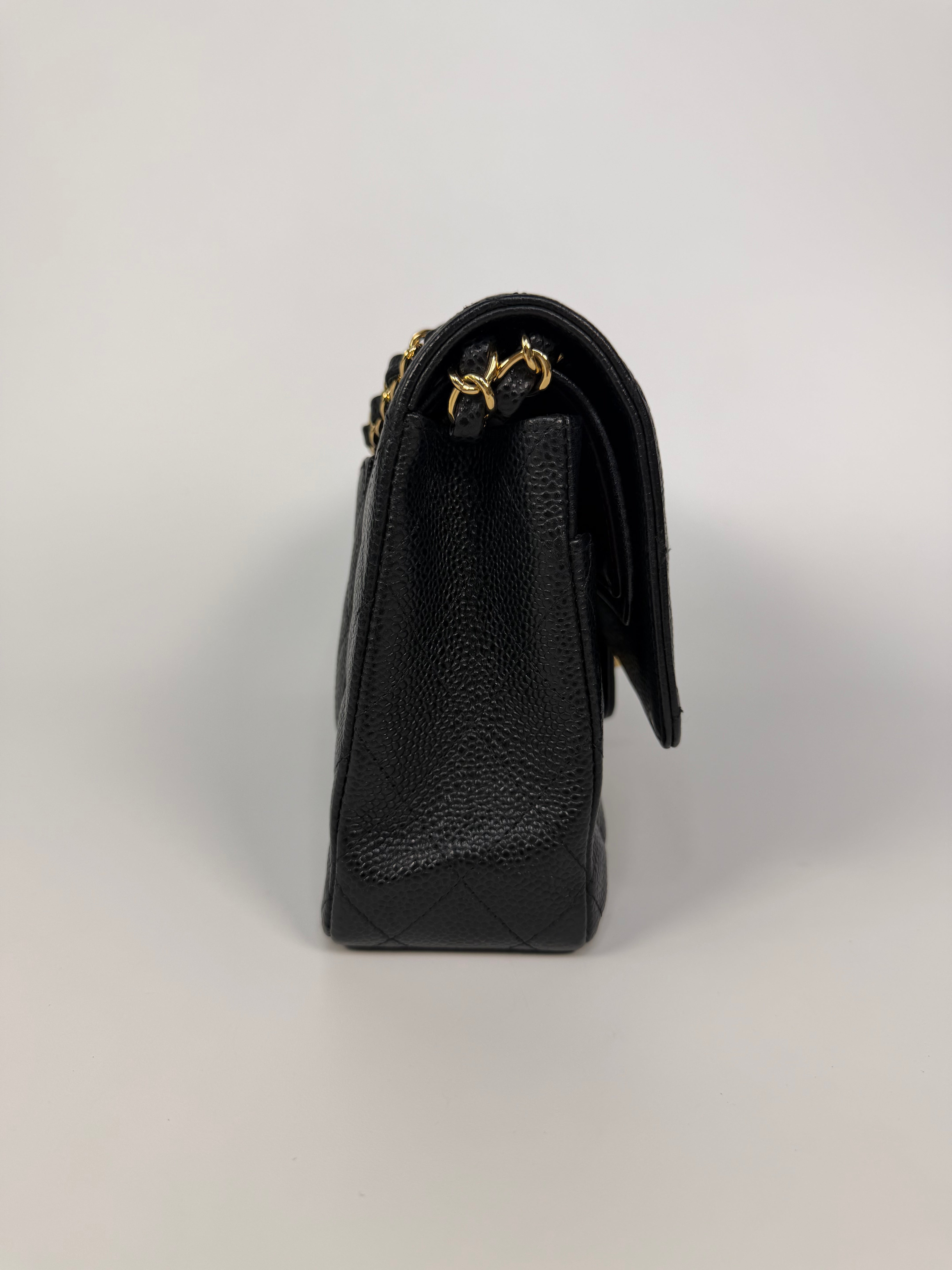 Chanel Medium Classic Double Flap In Black Caviar Leather Gold Hardware. 100% authentic and preloved in excellent condition