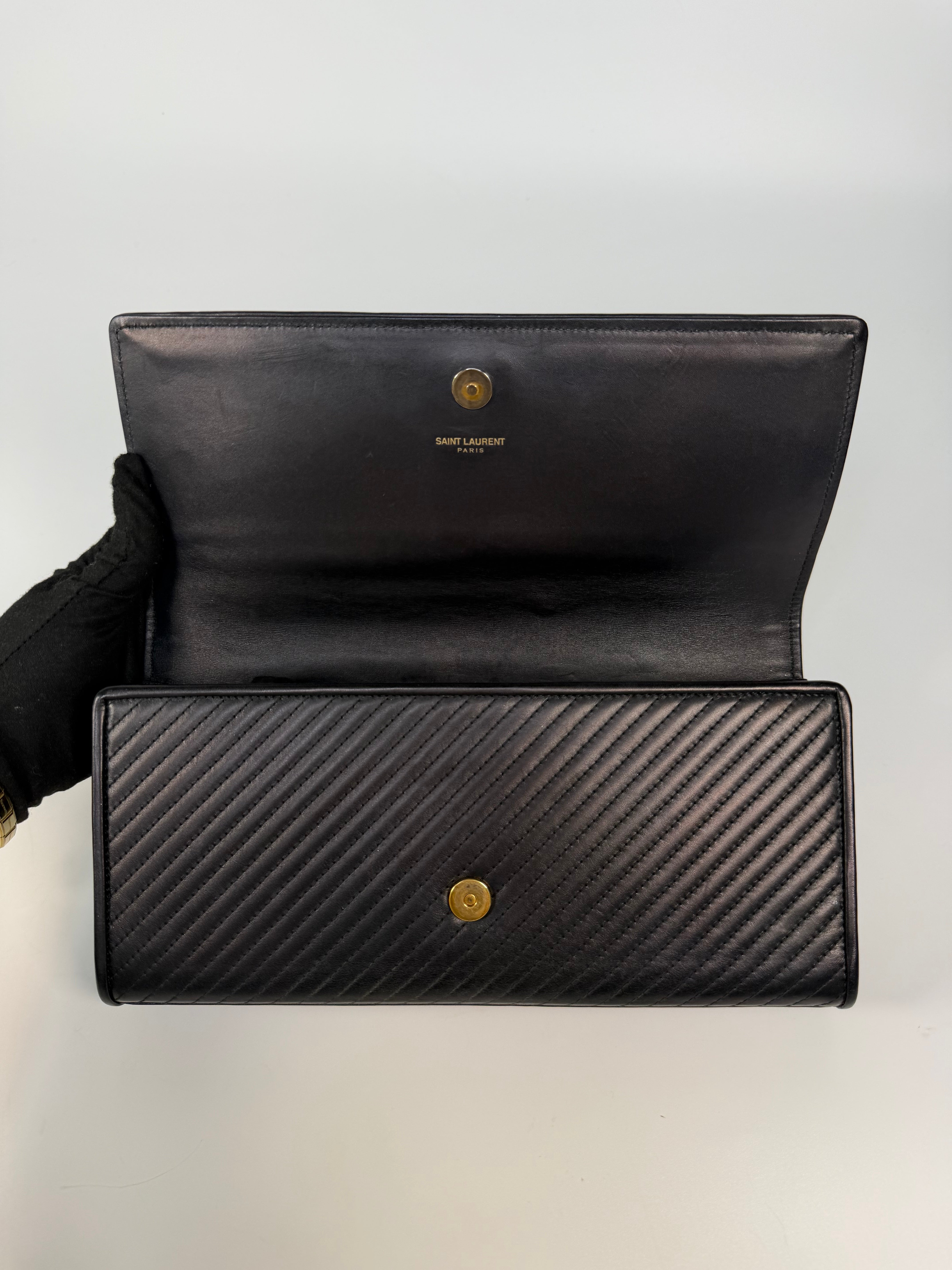 Saint Laurent Kate Long Clutch In Black Leather Gold Hardware. 100% authentic and preloved in very good condition