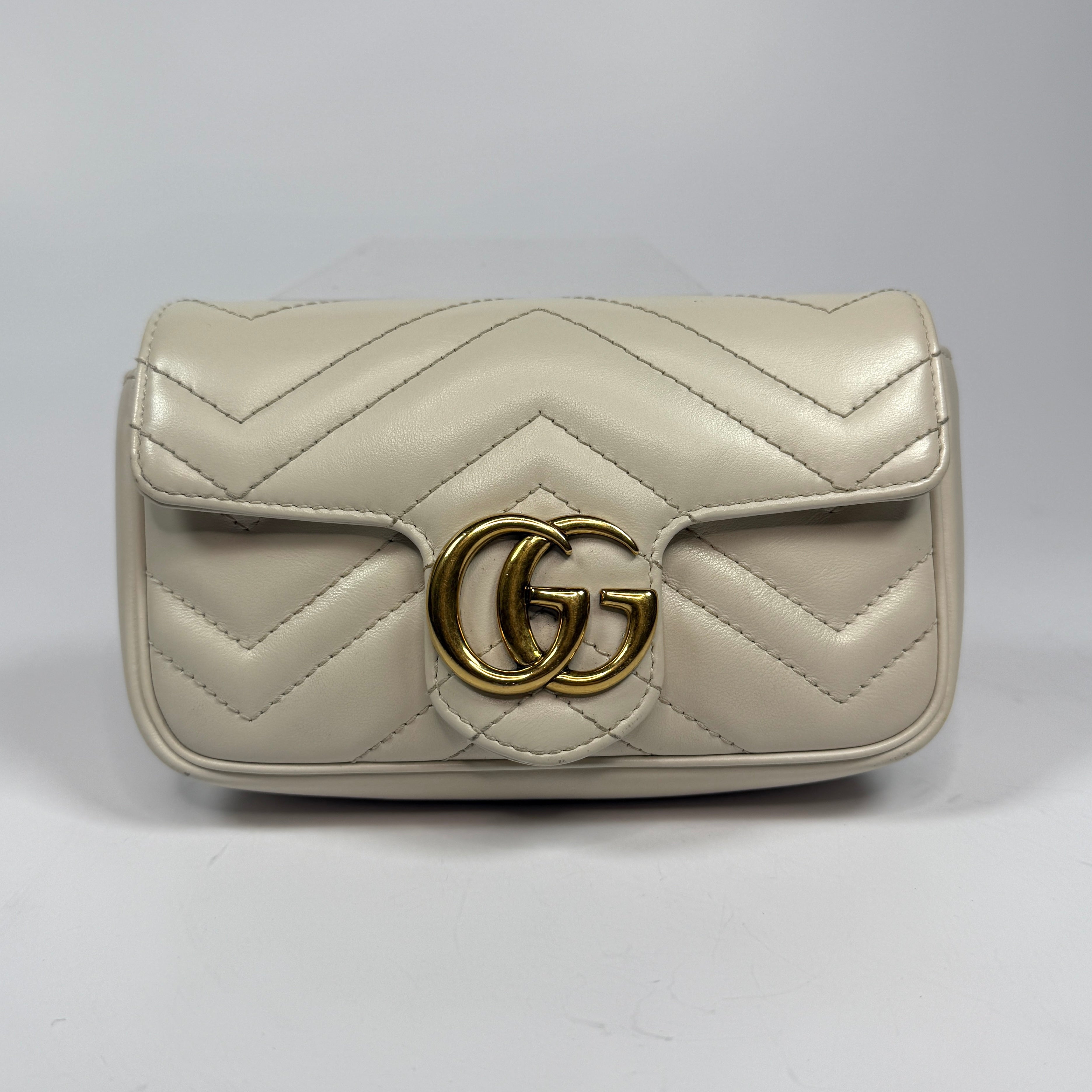 Gucci Marmont White Matelassé Super Mini Bag With Gold Hardware In Excellent pre loved condition. Authentic and preloved