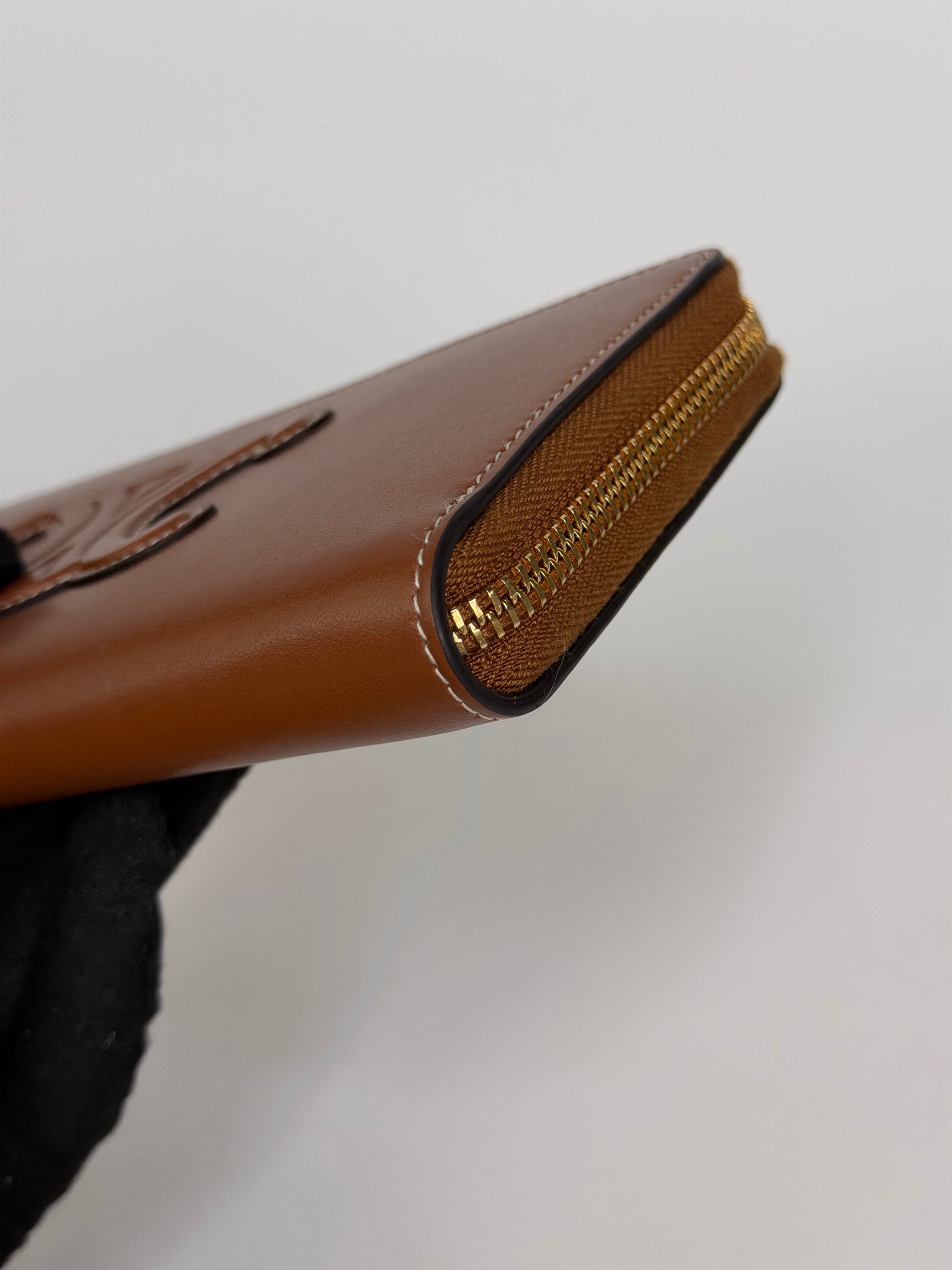 Celine Triomphe Long Wallet In Tan Calfskin With Gold Hardware. Authentic and preloved in excellent condition