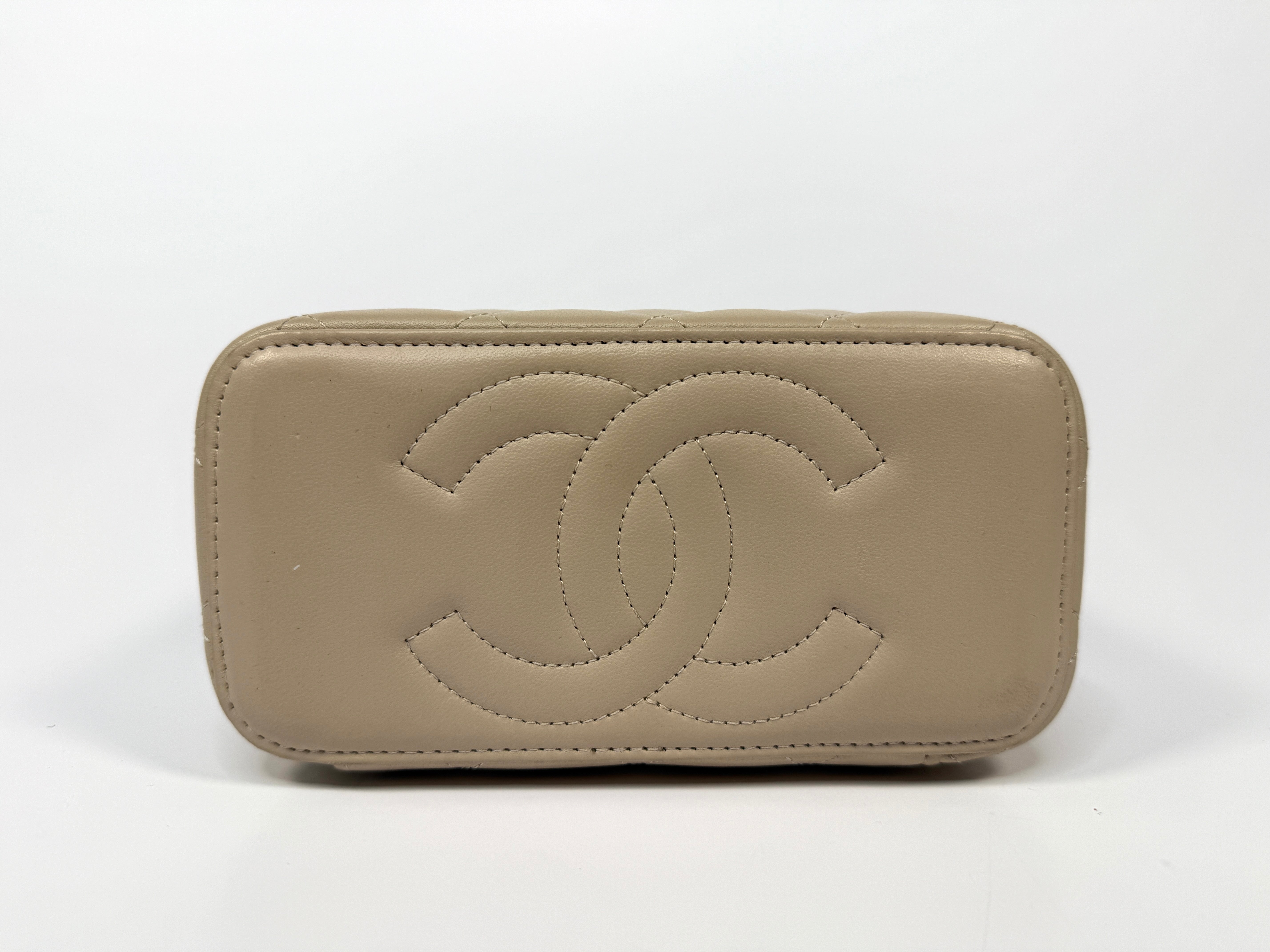 Chanel Vanity Rectangular Top Handle Ecru/Beige Lambskin With Gold Hardware Authentic and preloved. Excellent condition.